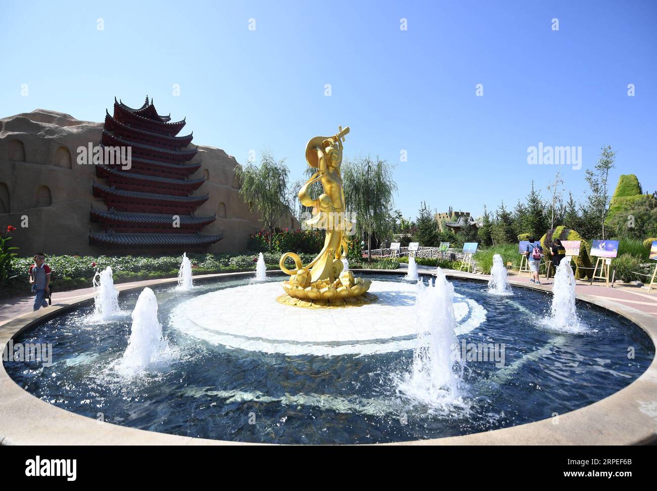 (190827) -- GANSU, Aug. 27, 2019 -- Tourists visit the Gansu Garden at the Beijing International Horticultural Exhibition in Beijing, capital of China, Aug. 25, 2019. Located in the convergence zone of the Loess Plateau, the Mongolian Plateau and the Qinghai-Tibet Plateau, Gansu Province in northwest China strides across various landforms including grasslands, forests, deserts, wetlands and mountains. In recent years, through persistent efforts on protecting water conservation area, containing desertification and resuming forests from farmlands, the ecological environment of Gansu has witnesse Stock Photo