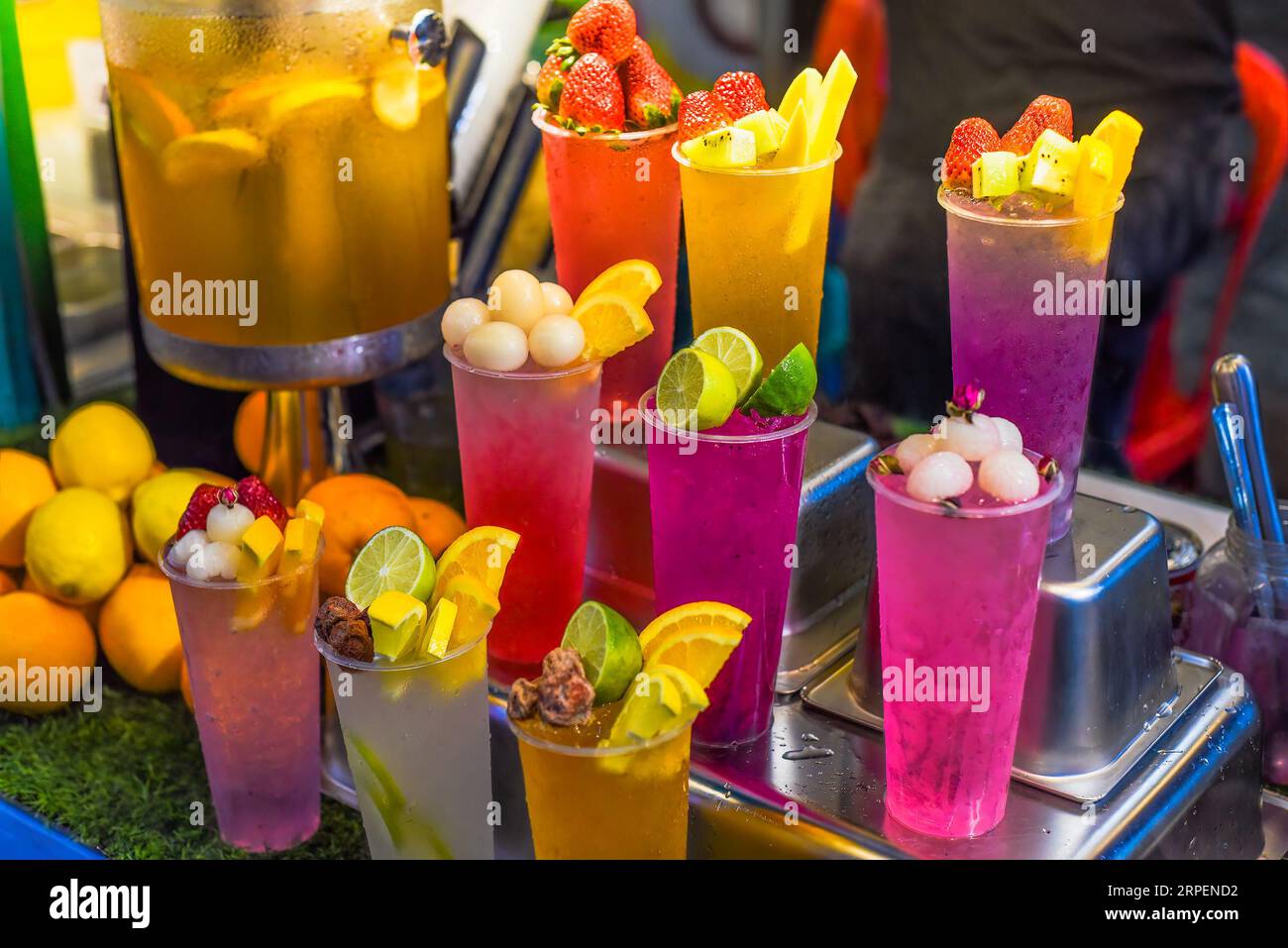 Plastic cups with refreshing drinks with alcohol in the bar of a summer  festival in Spain Stock Photo - Alamy