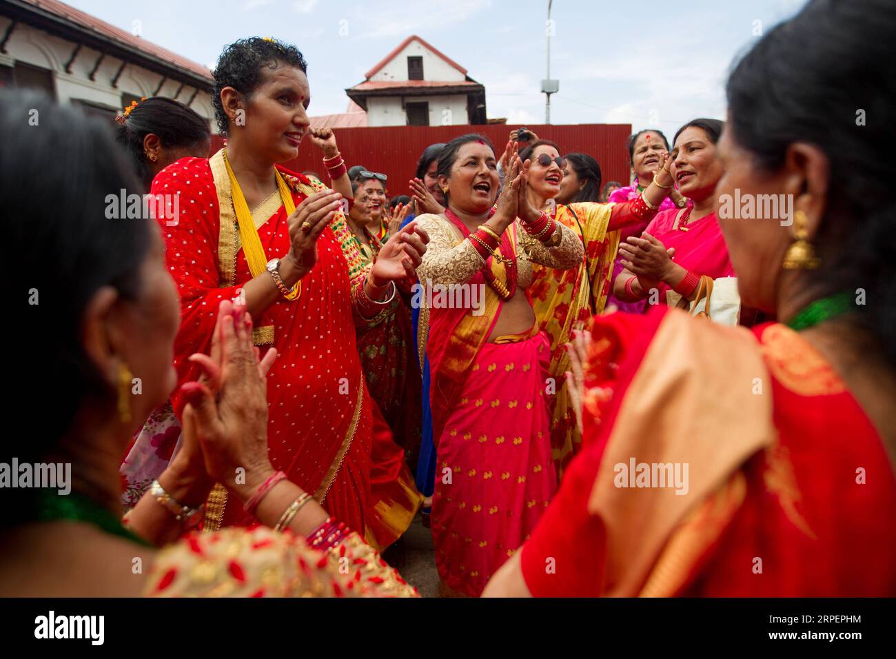 (190902) -- KATHMANDU, Sept. 2, 2019 -- Women dance during celebration of Teej festival at the premises of Pashupatinath Temple in Kathmandu, Nepal, Sept. 2, 2019. Nepali women on Monday celebrated the Hindu festival of Teej, during which married women fast for their husbands long life and good health while the unmarried pray for ideal husbands. (Photo by /Xinhua) NEPAL-KATHMANDU-FESTIVAL-TEEJ sulavxshrestha PUBLICATIONxNOTxINxCHN Stock Photo