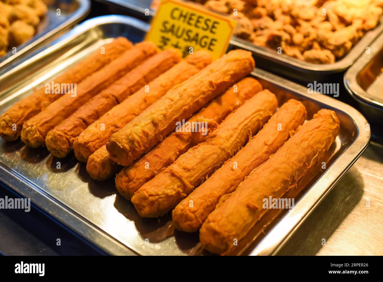 Fried cheese sausages in the street food Jalan Alor in Kuala Lumpur