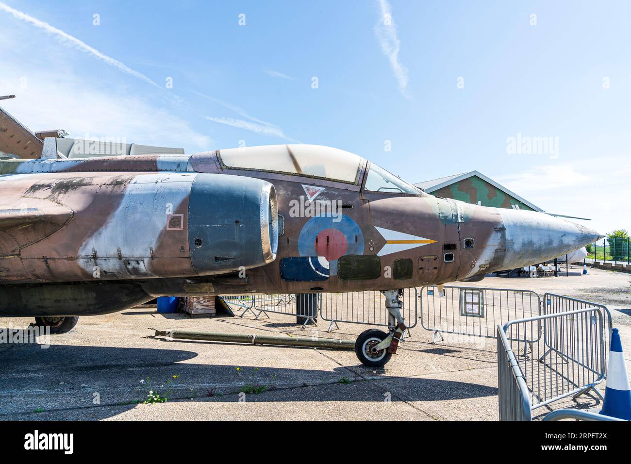 RAF fighter bomber Blackburn Buccaneer, with its wings folded, on display outside at the RAF Manston History Museum in Kent. Sunny, blue sky. Stock Photo