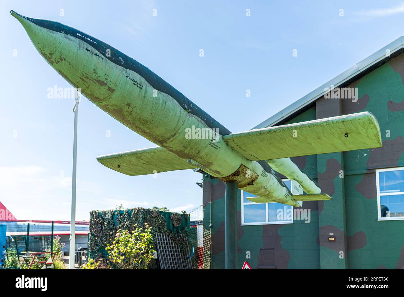 V-1 (vengeance weapon), flying bomb mounted on a stand, on display outside the RAF Manston History Museum in Kent on a summer's day with blue skies. Stock Photo