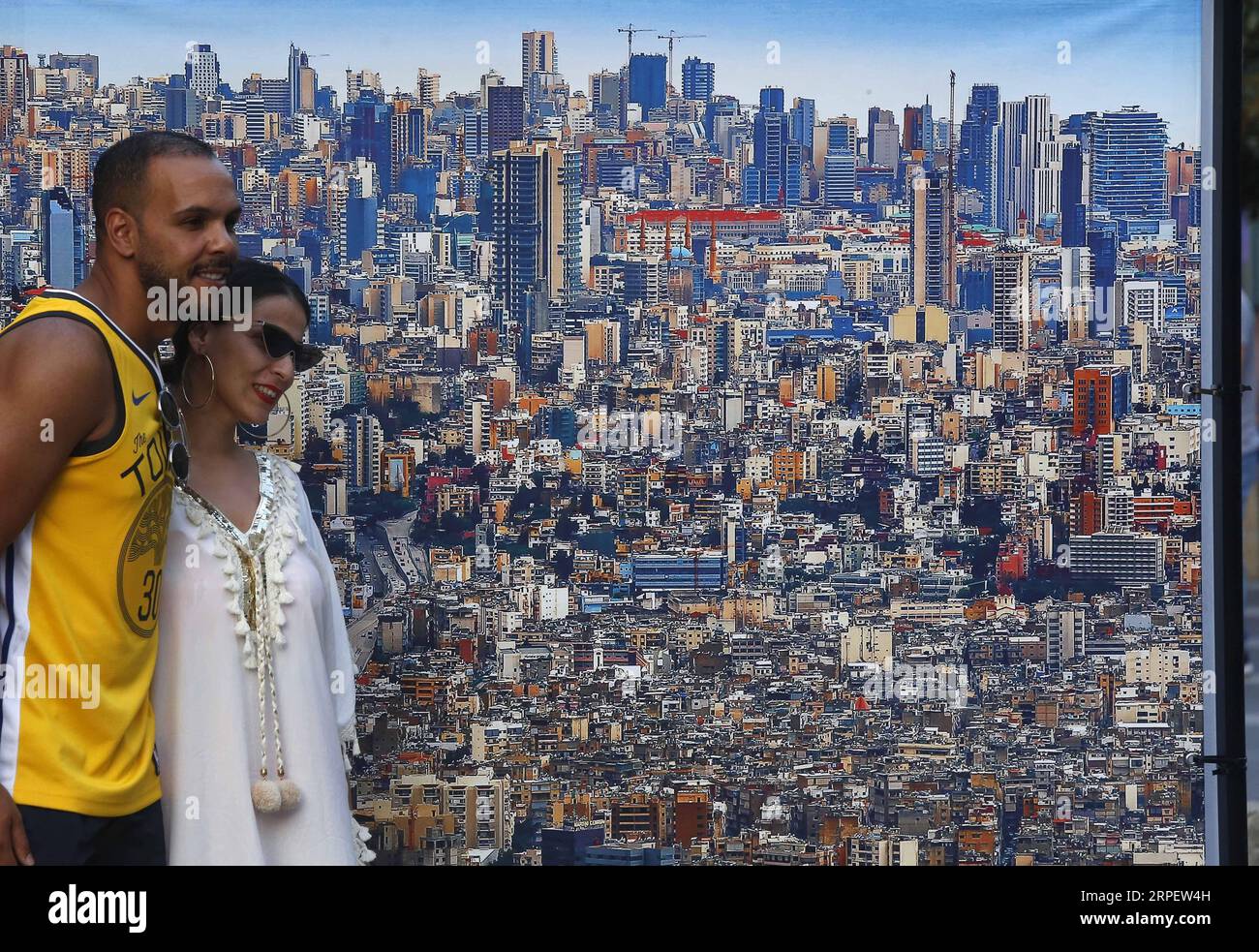 (190905) -- BEIJING, Sept. 5, 2019 -- People pose for photos in front of a photo during the opening exhibition of the Beirut Image Festival 2019 in Beirut, Lebanon, on Sept. 4, 2019. (Photo by /Xinhua) XINHUA PHOTOS OF THE DAY BilalxJawich PUBLICATIONxNOTxINxCHN Stock Photo