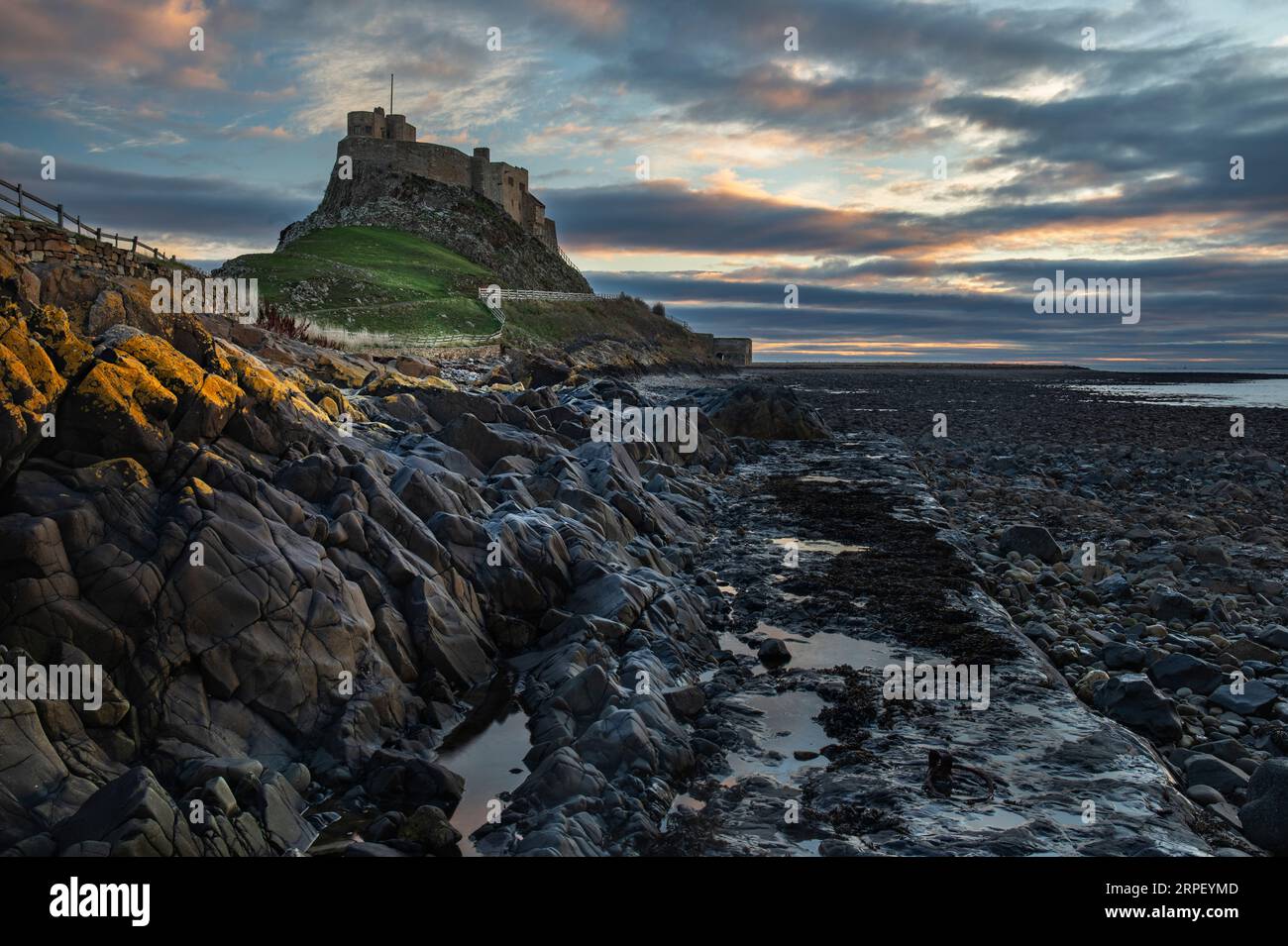 Lindisfarne Castle Photographed at Sunrise in November. Holy Island, Northumberland. Stock Photo