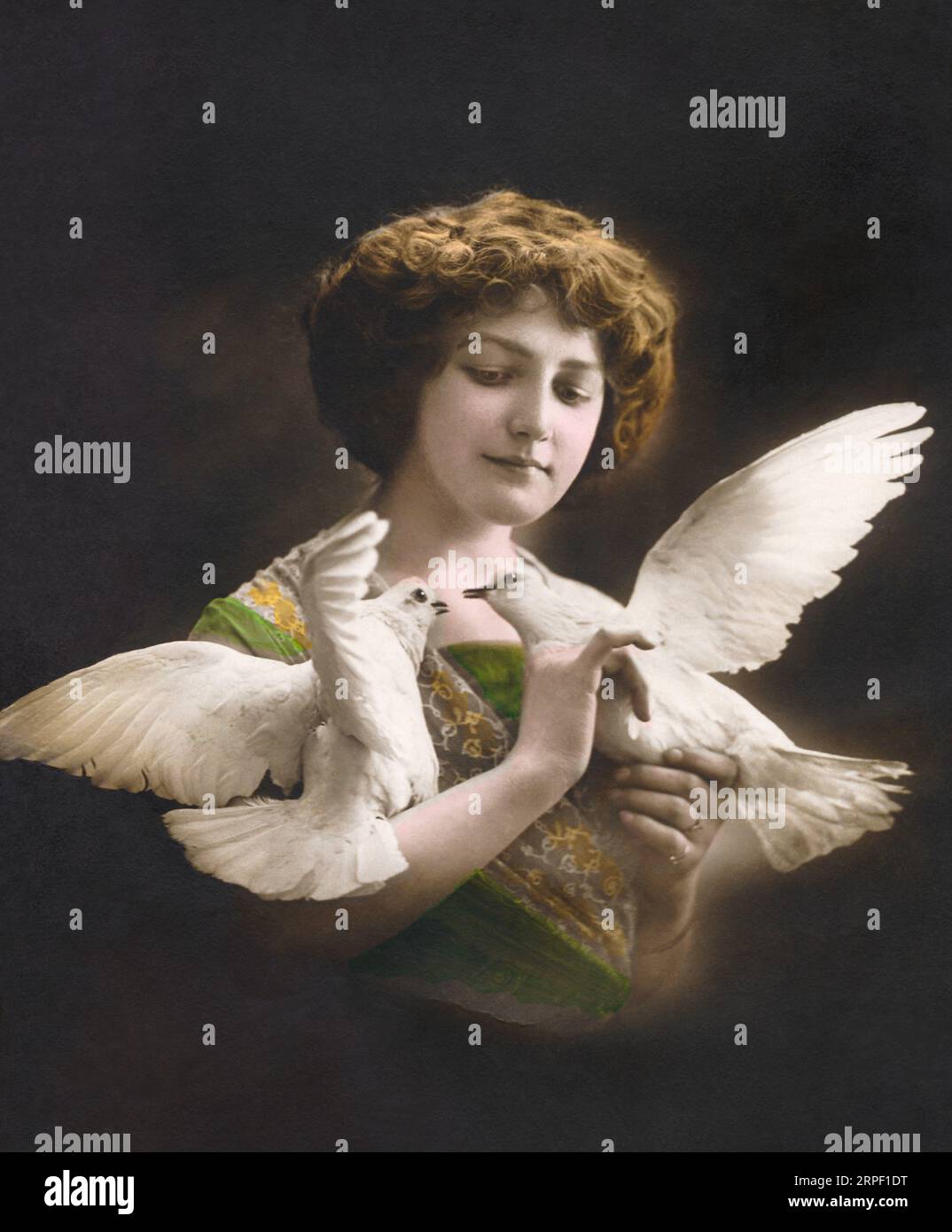 Edwardian photo of a woman with two doves. Stock Photo
