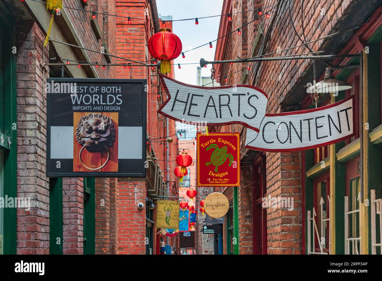 The narrow Fan Tan alley with shops in Victoria, British Columbia, Canada. Stock Photo