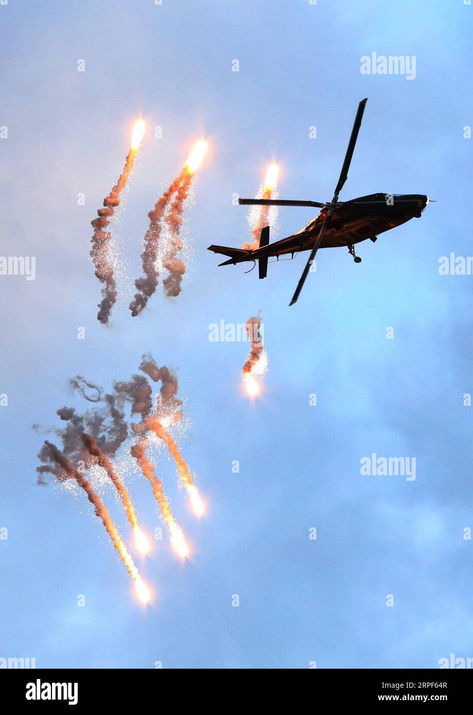 (190914) -- BRUSSELS, Sept. 14, 2019 -- A helicopter Agusta A-109 of the Belgian Air Force flies at the Sanicole Sunset Airshow in Hechtel, Belgium, Sept. 13, 2019. ) BELGIUM-SANICOLE SUNSET AIRSHOW WangxXiaojun PUBLICATIONxNOTxINxCHN Stock Photo