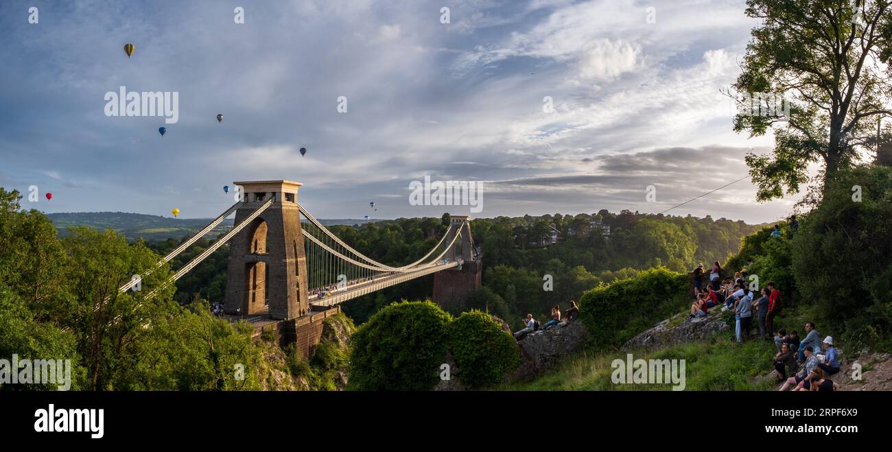 Mass ascent of hot-air balloons at Bristol Balloon Fiesta above Clifton Suspension Bridge Stock Photo