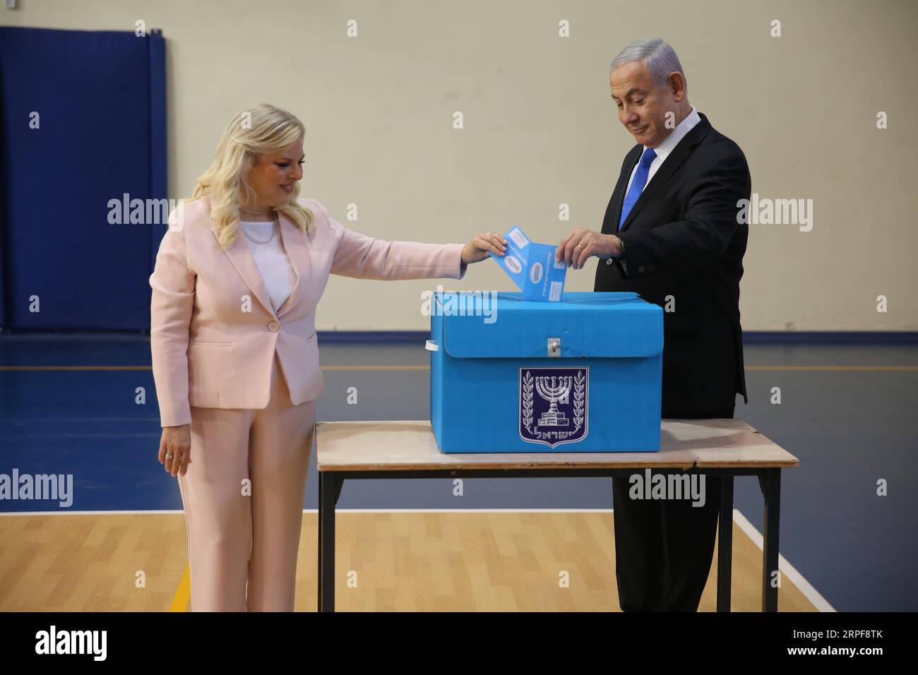 (190917) -- JERUSALEM, Sept. 17, 2019 (Xinhua) -- Israeli Prime Minister Benjamin Netanyahu (R) and his wife Sara Netanyahu cast their ballots at a polling station in Jerusalem, Sept. 17, 2019. The second Israeli parliamentary elections in five months are underway on Tuesday and will decide whether the nation s longest-serving prime minister, Benjamin Netanyahu, could stay in power. (Alex kolomoisky/JINI/Handout via Xinhua) MIDEAST-ISRAEL-PM-SECOND PARLIAMENTARY ELECTIONS PUBLICATIONxNOTxINxCHN Stock Photo