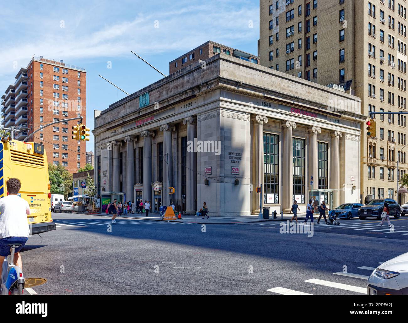 Upper West Side: Walker & Gillette designed East River Savings Bank in neo-Classical style. The 1926 landmark is now a school and drugstore. Stock Photo