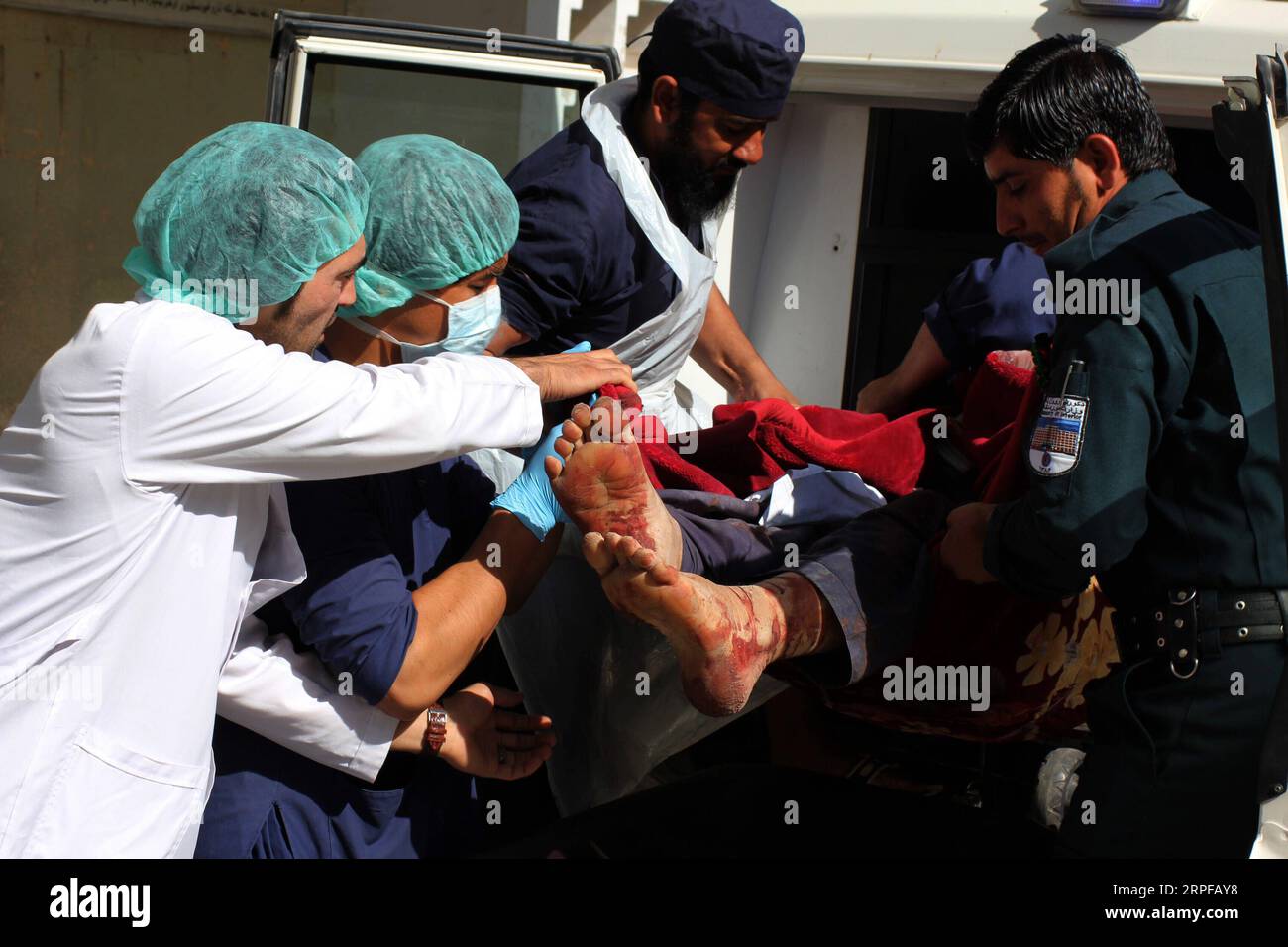 190919 -- KANDAHAR, Sept. 19, 2019 Xinhua -- People take a man injured in a car bomb at Zabul province out of a vehicle for medical treatment at a hospital in Kandahar city, southern Afghanistan, Sept. 19, 2019. The death toll of a car bomb on Thursday that rocked Qalat city, the capital of southern Afghanistan s Zabul province, has risen to 20, with over 93 others wounded, provincial government spokesman Gul Islam Sayal said. Photo by Sanaullah Seiam/Xinhua SPOT NEWS AFGHANISTAN-ZABUL-CAR BOMB-DEATH TOLL PUBLICATIONxNOTxINxCHN Stock Photo