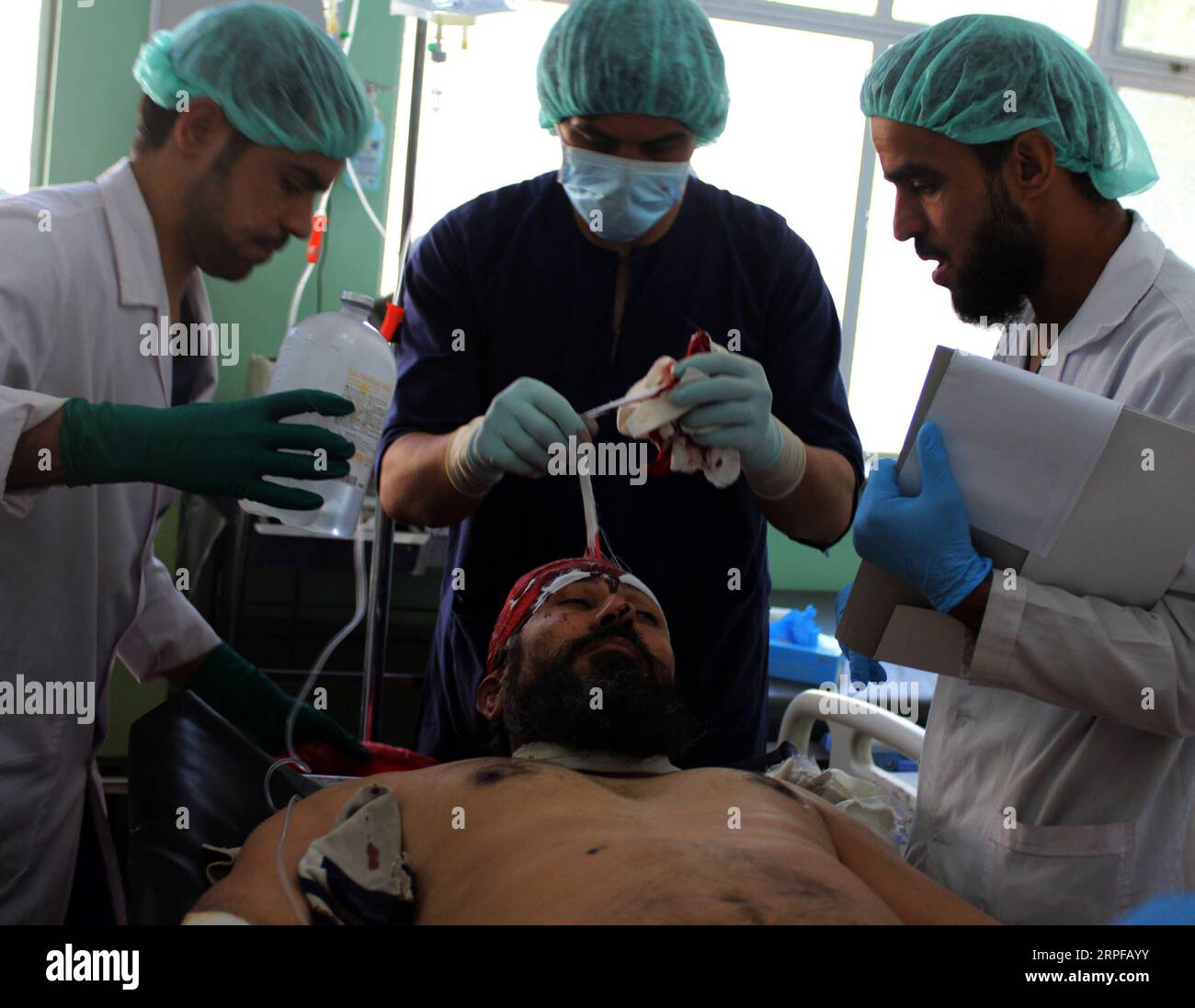190919 -- KANDAHAR, Sept. 19, 2019 Xinhua -- A man injured in a car bomb at Zabul province receives medical treatment at a hospital in Kandahar city, southern Afghanistan, Sept. 19, 2019. The death toll of a car bomb on Thursday that rocked Qalat city, the capital of southern Afghanistan s Zabul province, has risen to 20, with over 93 others wounded, provincial government spokesman Gul Islam Sayal said. Photo by Sanaullah Seiam/Xinhua SPOT NEWS AFGHANISTAN-ZABUL-CAR BOMB-DEATH TOLL PUBLICATIONxNOTxINxCHN Stock Photo