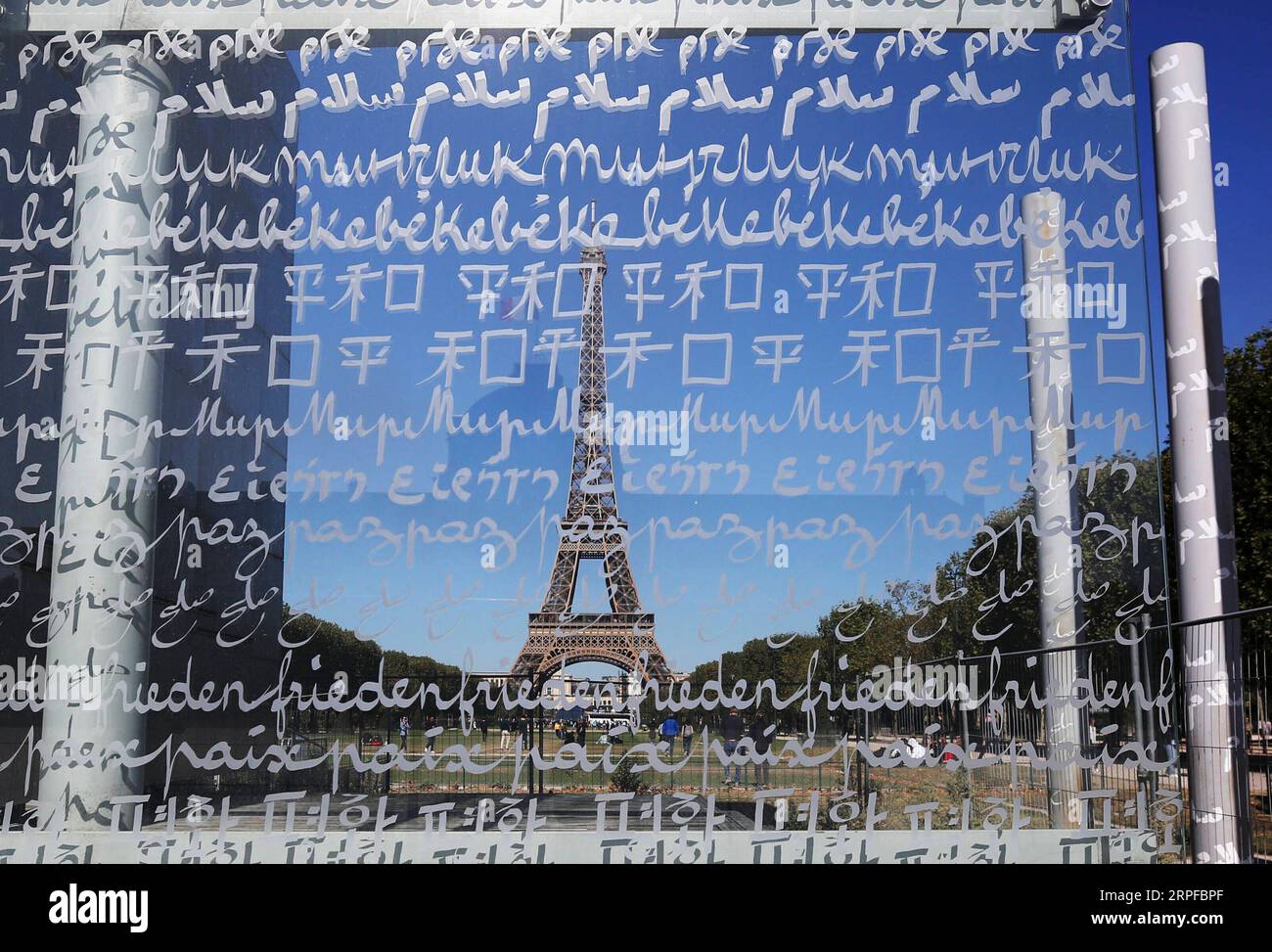 190920 -- BEIJING, Sept. 20, 2019 -- Photo taken on Sept. 19, 2019 shows the Wall for Peace beside Eiffel Tower in Paris, France. The word PEACE is engraved on it in 32 languages.  XINHUA PHOTOS OF THE DAY GaoxJing PUBLICATIONxNOTxINxCHN Stock Photo