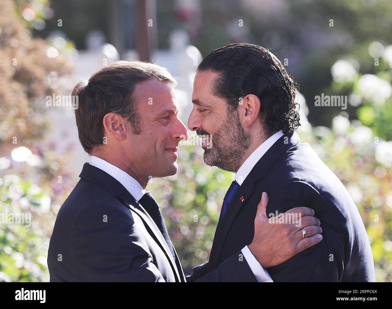 190920 -- PARIS, Sept. 20, 2019 -- French President Emmanuel Macron L welcomes visiting Lebanese Prime Minister Saad Hariri before their meeting at the Elysee Palace in Paris, France, Sept. 20, 2019.  FRANCE-PARIS-EMMANUEL MACRON-LEBANON-SAAD HARIRI GaoxJing PUBLICATIONxNOTxINxCHN Stock Photo
