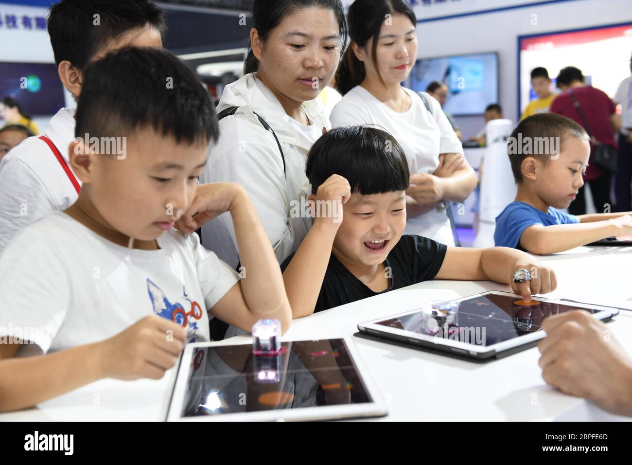 190922 -- HEFEI, Sept. 22, 2019 -- Children experience an intelligent programming educational robot during the 2019 World Manufacturing Convention in Hefei, east China s Anhui Province, Sept. 21, 2019.  Xinhua Headlines: China advances with world in manufacturing upgrades ZhangxDuan PUBLICATIONxNOTxINxCHN Stock Photo