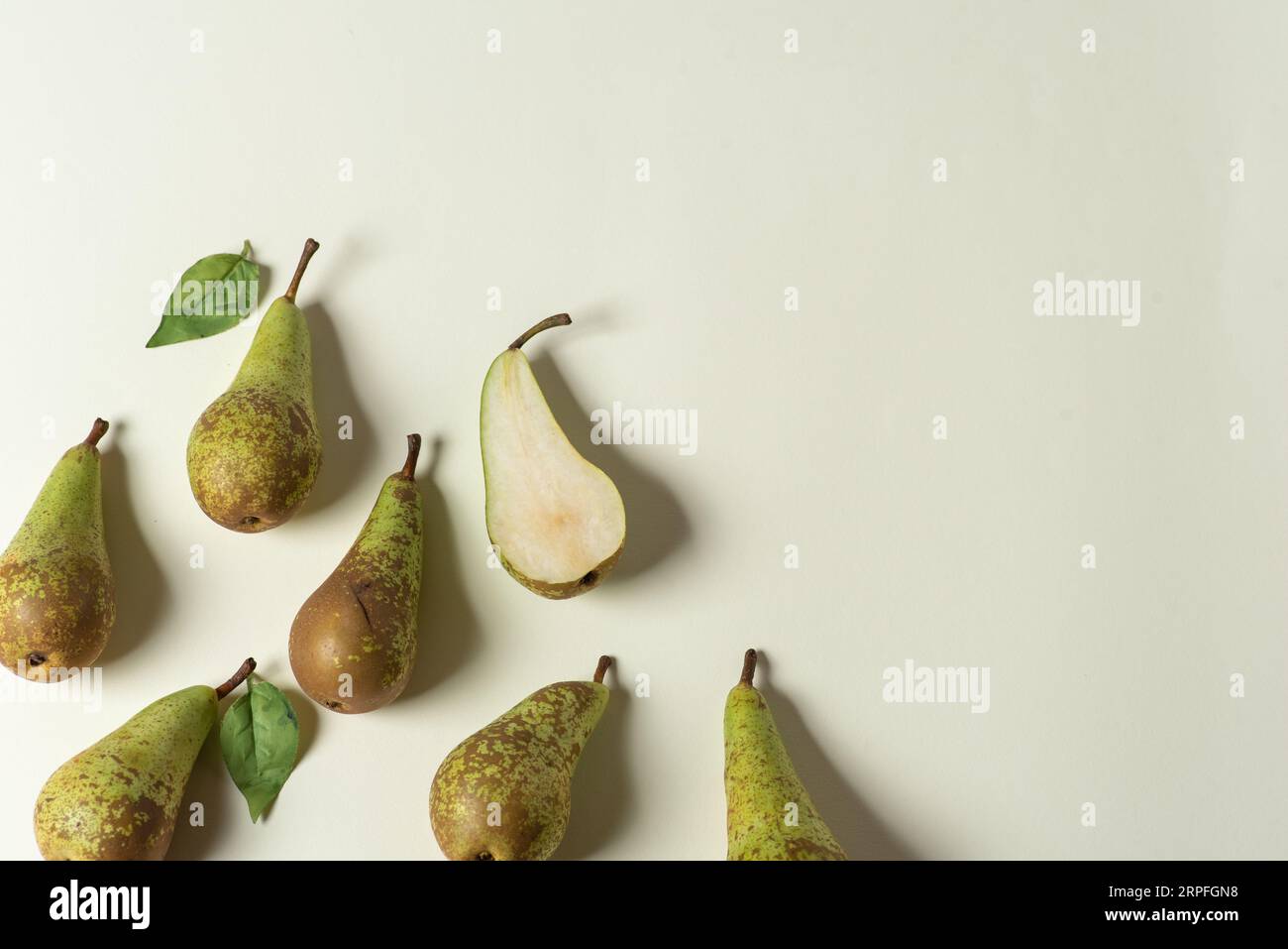 Few large, green, organic pears on a white background Stock Photo