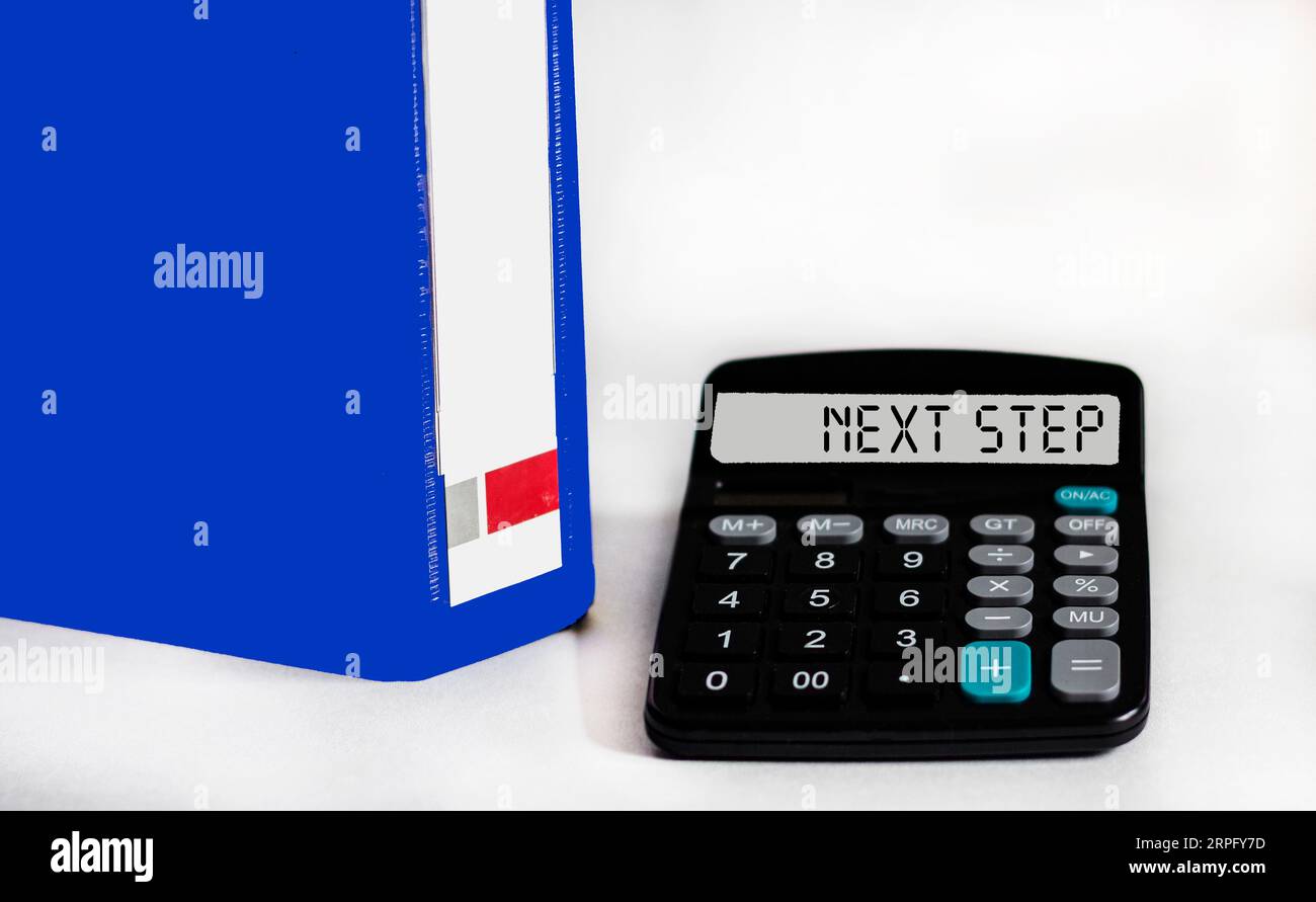 What's next, Business concept on calculator and white background Stock Photo