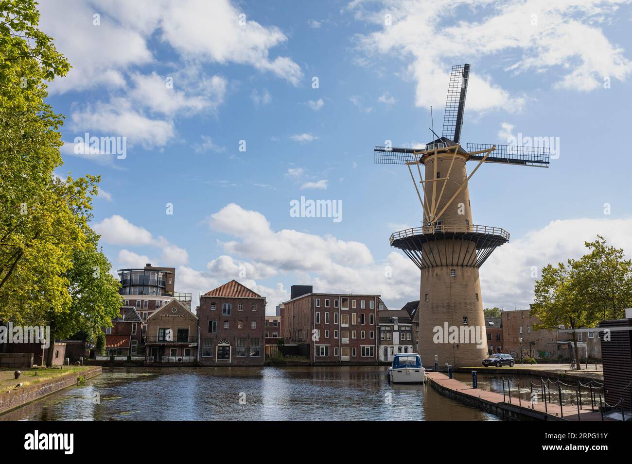 View on harbor of Schiedam with windmill 'the Palm Tree' Stock Photo