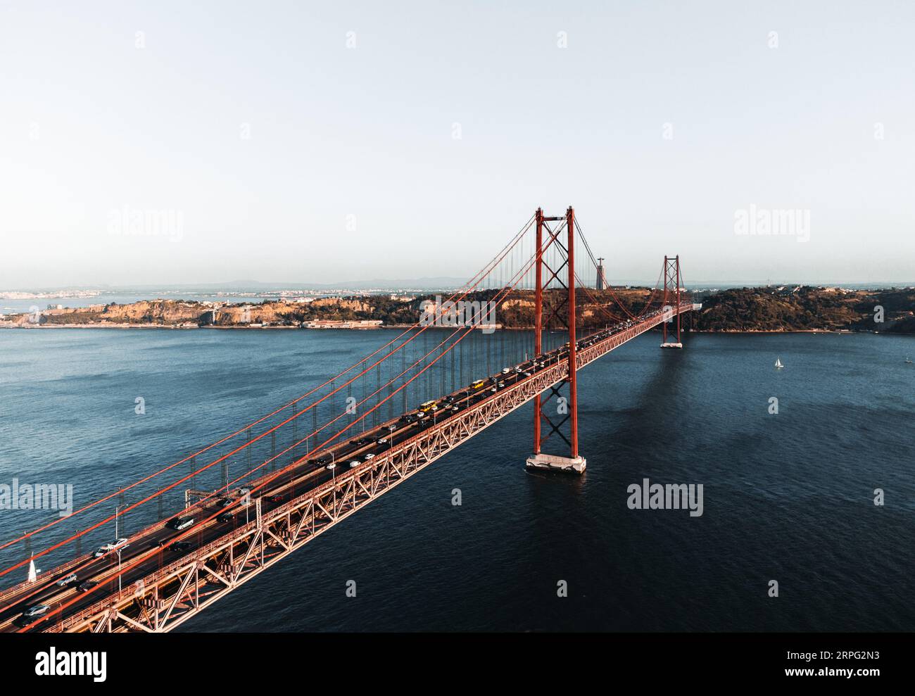 Aerial photos of the 25 April bridge (Ponte 25 de Abril) located in Lisbon, Portugal, crossing the Targus river - taken by drone. Stock Photo