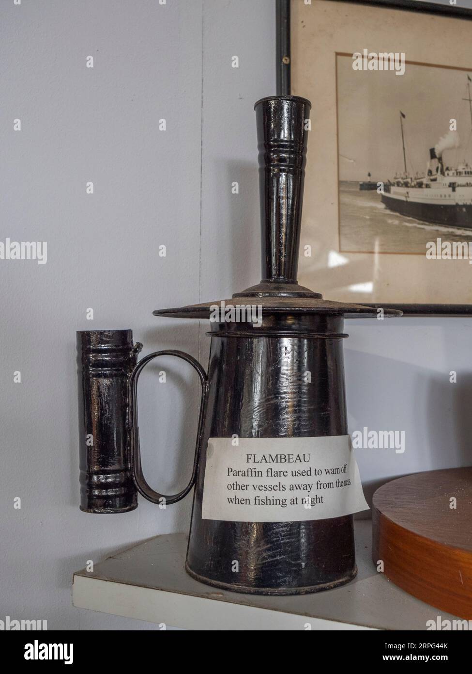 A flambeau, a paraffin flare used on fishing boats to warn off other cessels, on display in the Newhaven Museum, Newhaven, East Sussex, UK. Stock Photo
