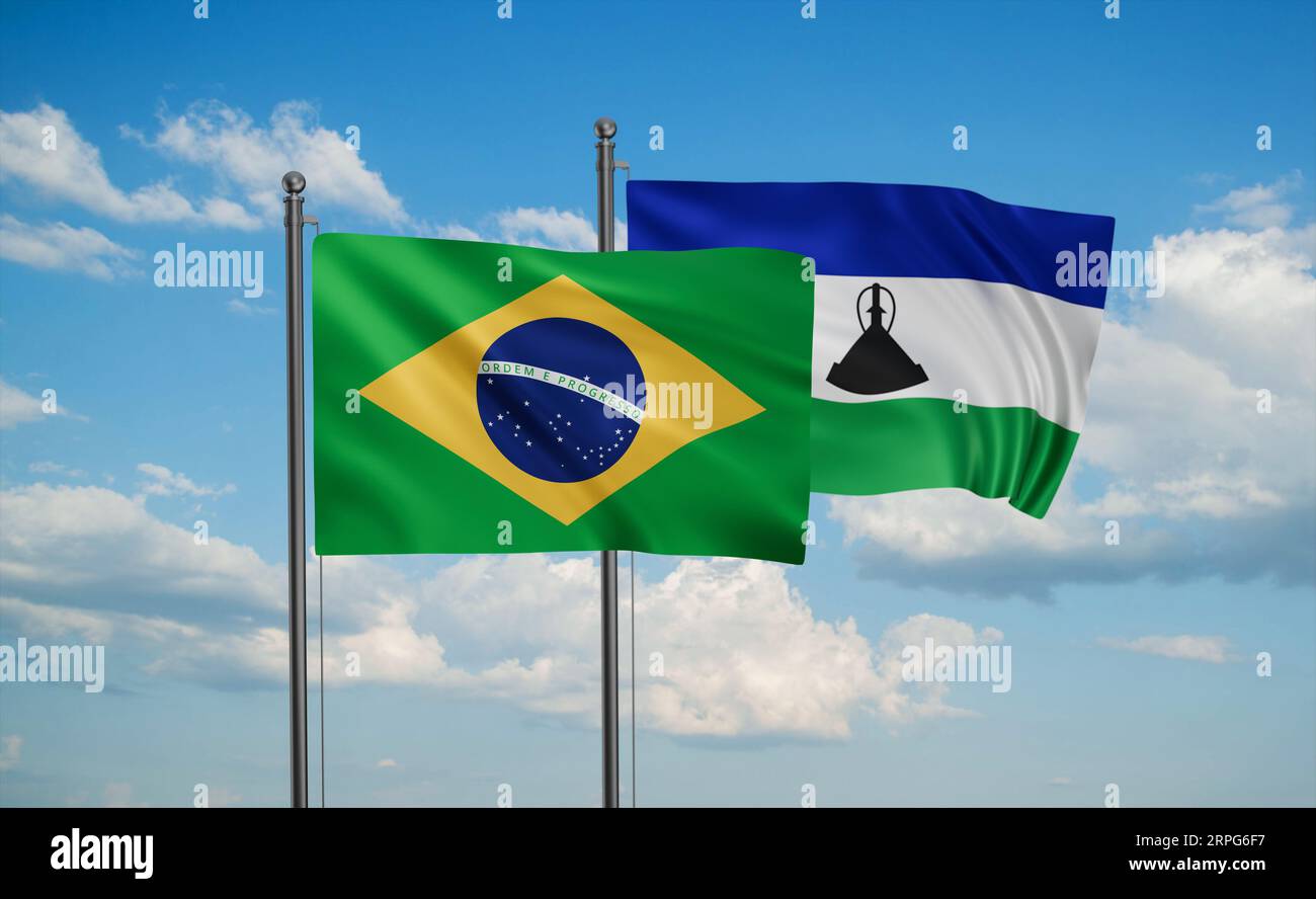 Lesotho and Brazil flag waving together in the wind on blue sky, two ...