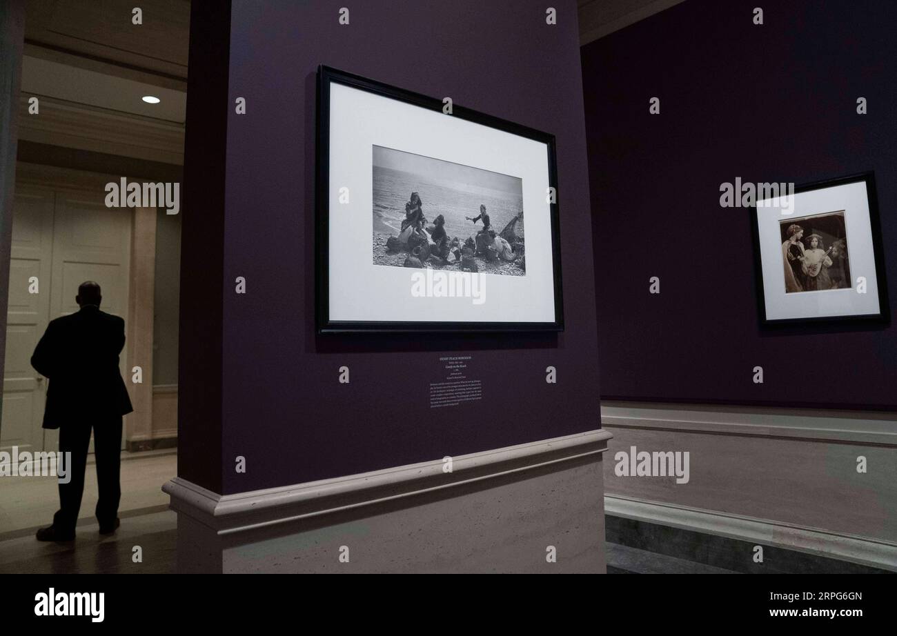 191004 -- WASHINGTON, Oct. 4, 2019 -- Photo taken on Oct. 4, 2019 shows Henry Peach Robinson s Gossip on the Beach L at the exhibition The Eye of the Sun: Nineteenth-Century Photographs from the National Gallery of Art in Washington D.C., the United States. The exhibition marks the 180th anniversary of photography s introduction to the world in 1839 and presents some 140 photographs offering an in-depth look at the development of the medium throughout its first 50 years. It will last until Dec. 1.  U.S.-WASHINGTON D.C.-PHOTO EXHIBITION LiuxJie PUBLICATIONxNOTxINxCHN Stock Photo