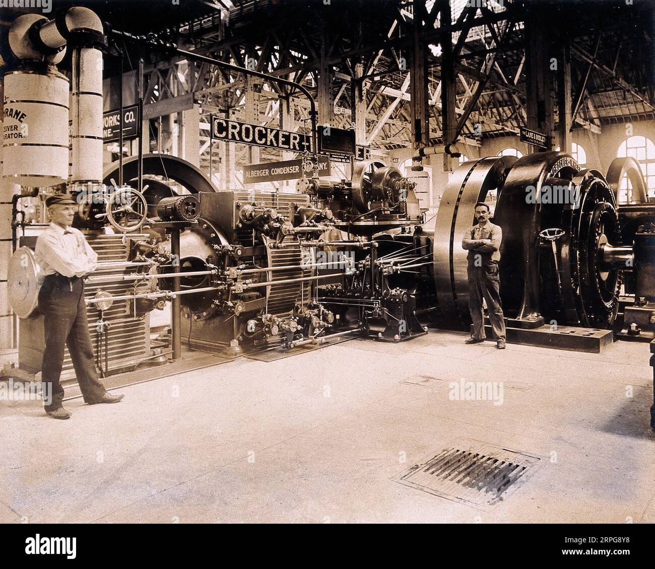 The 1904 World's Fair St. Louis, Missouri, an engine manufactured by the Crocker-Wheeler company with two attendants, photograph 1904 Stock Photo