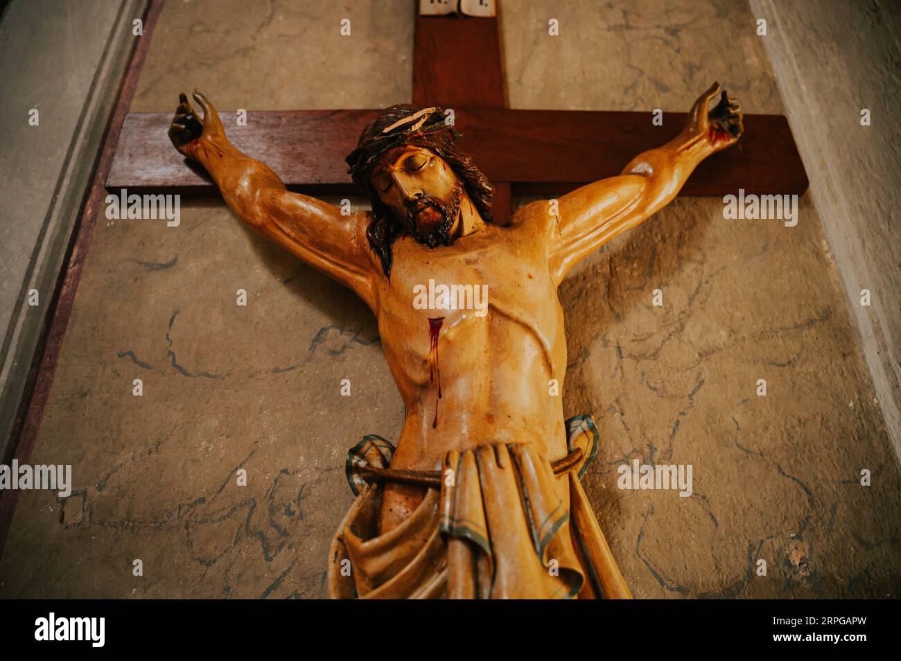 Jesus Christ's agony on the cross, serving as a poignant reminder of the Christian belief in salvation through His ultimate sacrifice Stock Photo