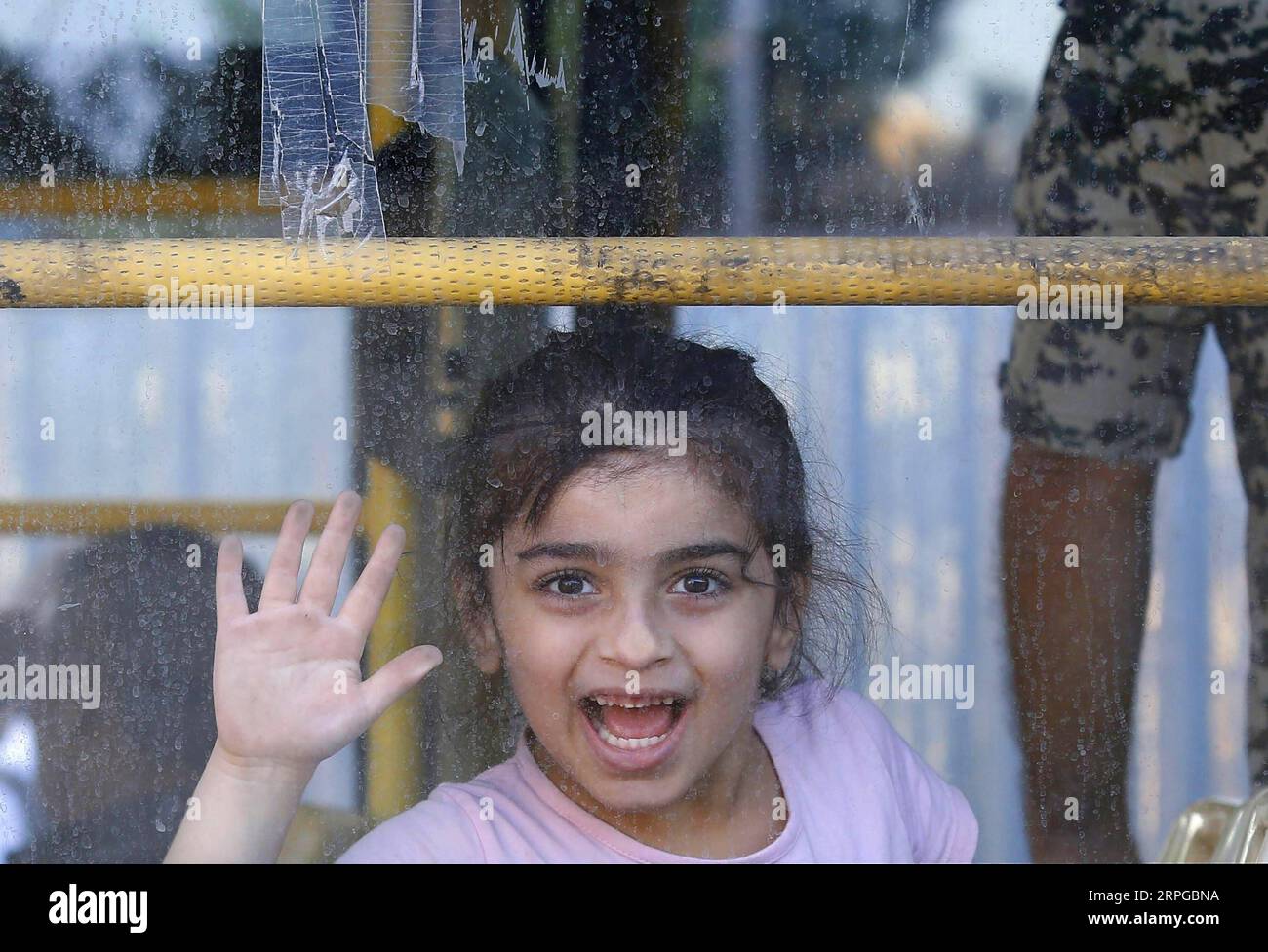 191010 -- BEIJING, Oct. 11, 2019 -- A Syrian girl goes on a homebound trip by bus from Beirut, Lebanon on Oct. 10, 2019. Around 1,000 Syrian refugees returned home from Lebanon on Thursday, the National News Agency reported. Syrians from different cities in Lebanon, including the capital Beirut, Zahle, Sidon and Tripoli, returned to their homeland by bus with the help of Lebanese General Security. Photo by Bilal Jawich/Xinhua XINHUA PHOTOS OF THE DAY LixLiangyong PUBLICATIONxNOTxINxCHN Stock Photo