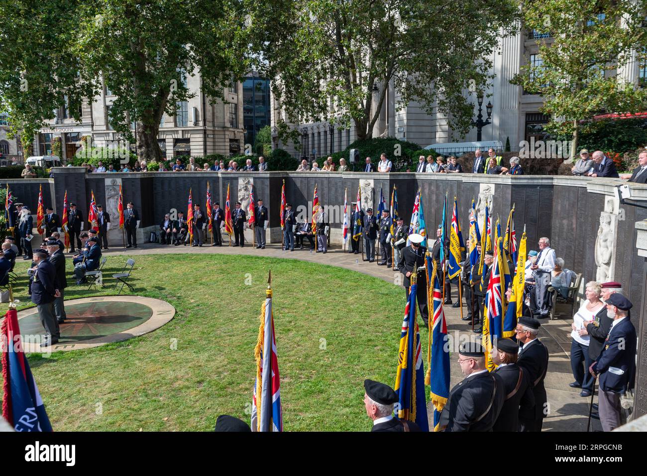 Merchant Navy Day Commemorative Service at CWGC Merchant Navy Memorial, Trinity Square Gardens, London, UK. Veterans at wartime losses memorial wall Stock Photo