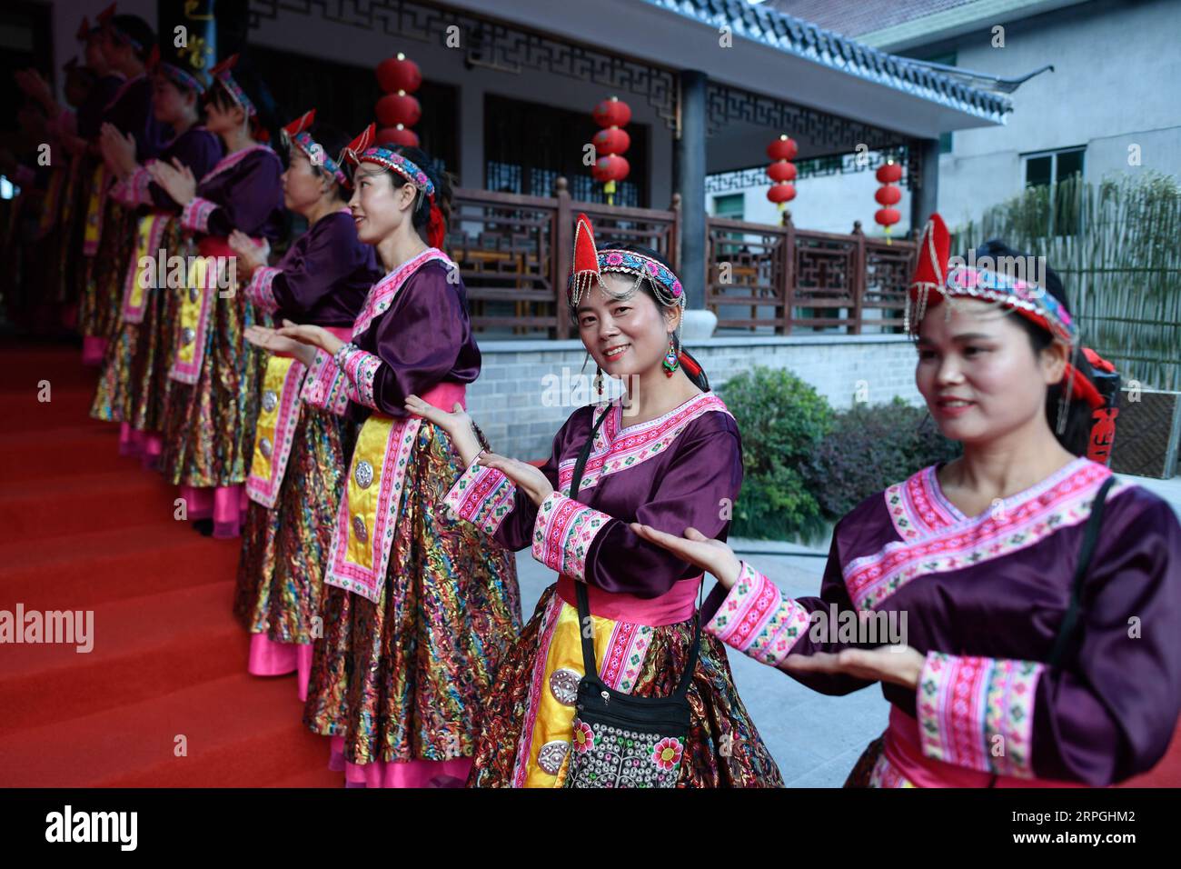 191016 -- HANGZHOU, Oct. 16, 2019 -- Local villagers in traditional costumes of the She ethnic group greet visitors at the long-table banquet held at Longfeng ethnic village in Eshan Township of the She ethnic group of Tonglu County, east China s Zhejiang Province, Oct. 16, 2019. More than 90 tables of delicacies were presented at the long-table banquet, attracting local villagers as well as tourists to enjoy the food of the She ethnic group.  CHINA-ZHEJIANG-ESHAN-LONG-TABLE BANQUET CN HuangxZongzhi PUBLICATIONxNOTxINxCHN Stock Photo