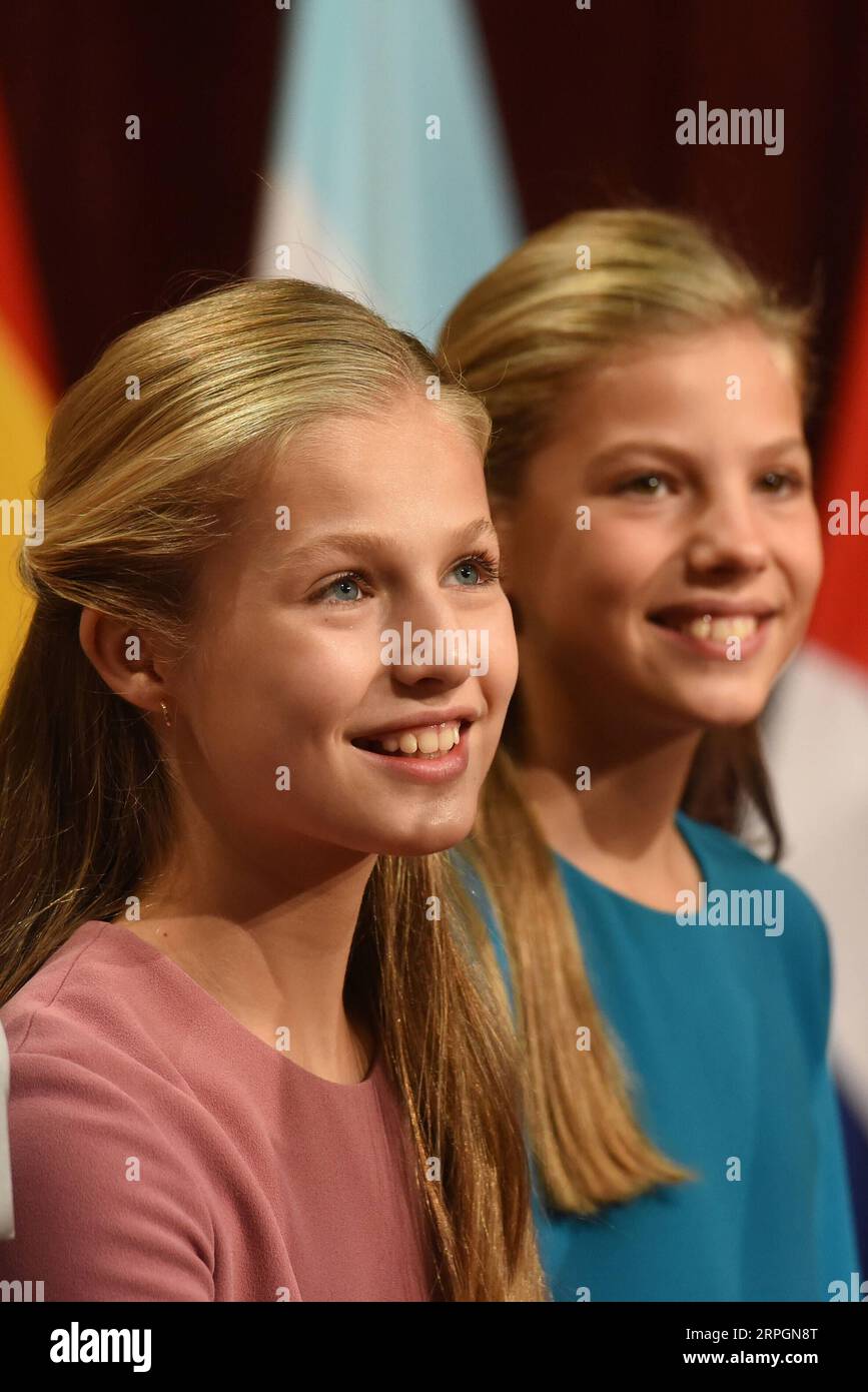 191019 -- OVIEDO, Oct. 19, 2019 -- Spain s Princess Leonor L and her sister, Princess Sofia attend the ceremony to present the Princess of Asturias Awards in Oviedo, Spain, Oct. 18, 2019. The annual ceremony to present the Princess of Asturias Awards was held Friday in the northern Spainish city of Oviedo, during which the 13-year-old Spanish princess delivered her debut speech. Today is a very important day in my life and one I have waited for with a lot of expectation, said Spain s Princess Leonor at the ceremony where her namesake awards were presented to individuals, entities or organizati Stock Photo