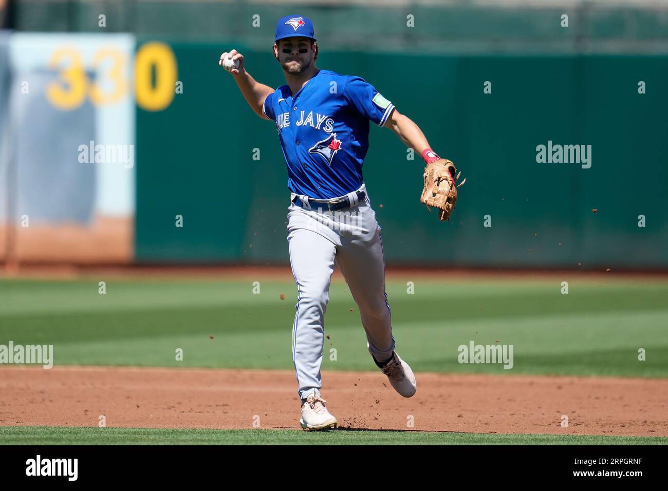 Toronto Blue Jays shortstop Ernie Clement throws out Oakland Athletics ...