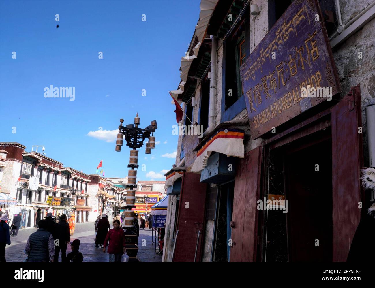 191022 -- LHASA, Oct. 22, 2019 -- Photo taken on Oct. 14, 2019 shows the Syamukapu Nepali Shop in Lhasa, southwest China s Tibet Autonomous Region. Covering an area of no more than 100 square meters, a century-old store catches the eyes of pedestrians in Barkhor Street in central Lhasa, with its traditional Tibetan furnishing on the front and a sign inscribed with the name in Tibetan, Chinese and English -- Syamukapu Nepali Shop. TO GO WITH Across China: Century-old Nepali store in Tibet sign of China-Nepal friendship  InTibetCHINA-TIBET-NEPALI STORE CN PurbuxZhaxi PUBLICATIONxNOTxINxCHN Stock Photo