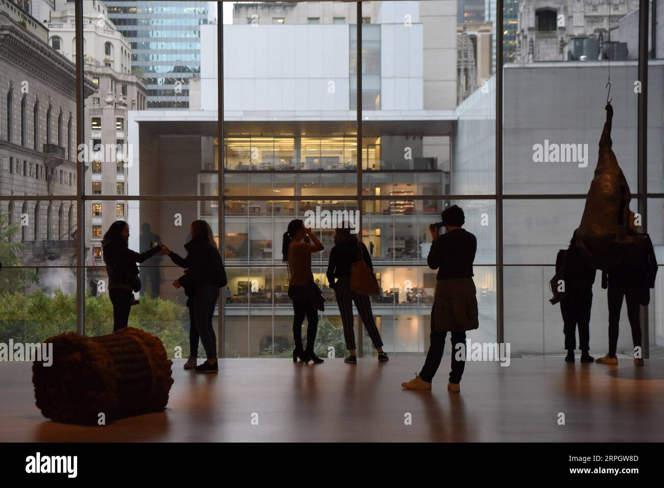 191023 -- NEW YORK, Oct. 23, 2019 -- Visitors enjoy the outside view in the Museum of Modern Art MoMA in Manhattan of New York, the United States, Oct. 22, 2019. MoMA was reopened to the public on Monday after being closed since June 15 for renovation and reorganization of its galleries.  U.S.-NEW YORK-MOMA-REOPENING HanxFang PUBLICATIONxNOTxINxCHN Stock Photo