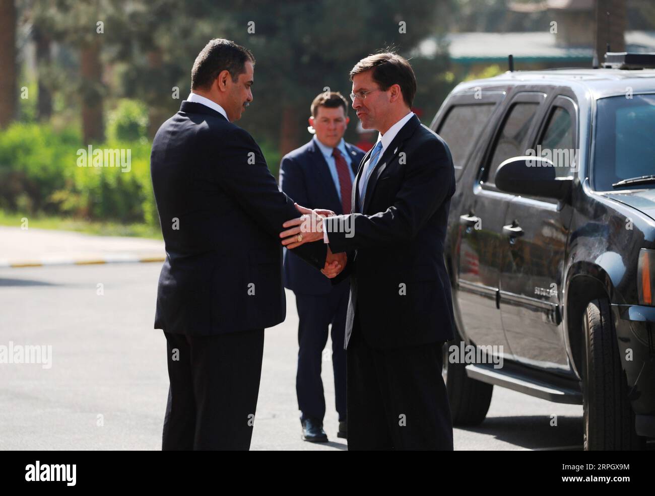 191023 -- BAGHDAD, Oct. 23, 2019 -- Iraqi Minister of Defense Najah al-Shammari L shakes hands with his U.S. counterpart Mark Esper in Baghdad, Iraq, Oct. 23, 2019. U.S. Defense Secretary Mark Esper arrived in Iraq on Wednesday to hold talks with Iraqi leaders about the pull-out of the U.S. troops from northern Syria, an Iraqi Defense Ministry source said. Esper arrived in the capital of Baghdad in the morning and held a meeting with his Iraqi counterpart Najah al-Shammari, discussing the U.S. troops withdrew from northern Syria, the source from the ministry media office told Xinhua. IRAQ-BAGH Stock Photo