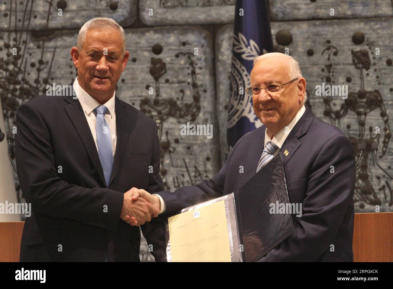 191023 -- JERUSALEM, Oct. 23, 2019 Xinhua -- Israeli President Reuven Rivlin R presents Blue and White party leader Benny Gantz with the mandate to form a new Israeli government at the President s residence in Jerusalem, on Oct. 23, 2019. Benny Gantz, Israel s former military chief, was given on Wednesday the mandate to form a new government after Prime Minister Benjamin Netanyahu s failure to do so amid a political deadlock. Photo by Gil Cohen Magen/Xinhua MIDEAST-JERUSALEM-BENNY GANTZ-MANDATE- GOVERNMENT FORMING PUBLICATIONxNOTxINxCHN Stock Photo