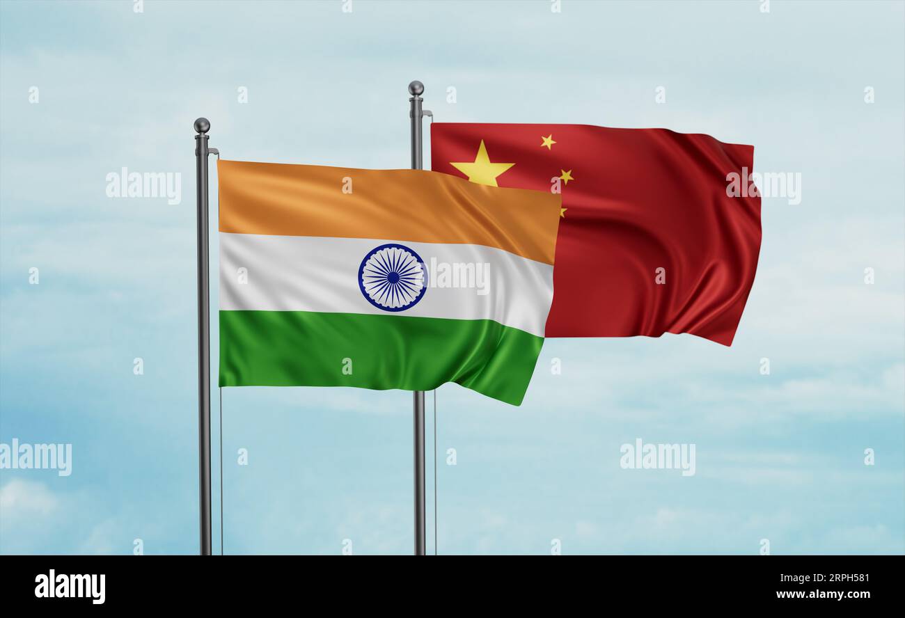 China flag and India flag waving together on blue sky, two country cooperation concept Stock Photo