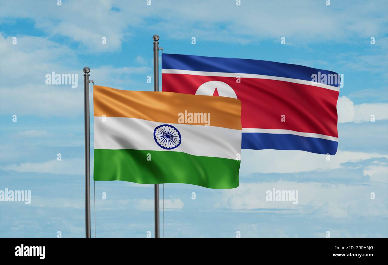 North Korea and India flag waving together in the wind on blue sky ...