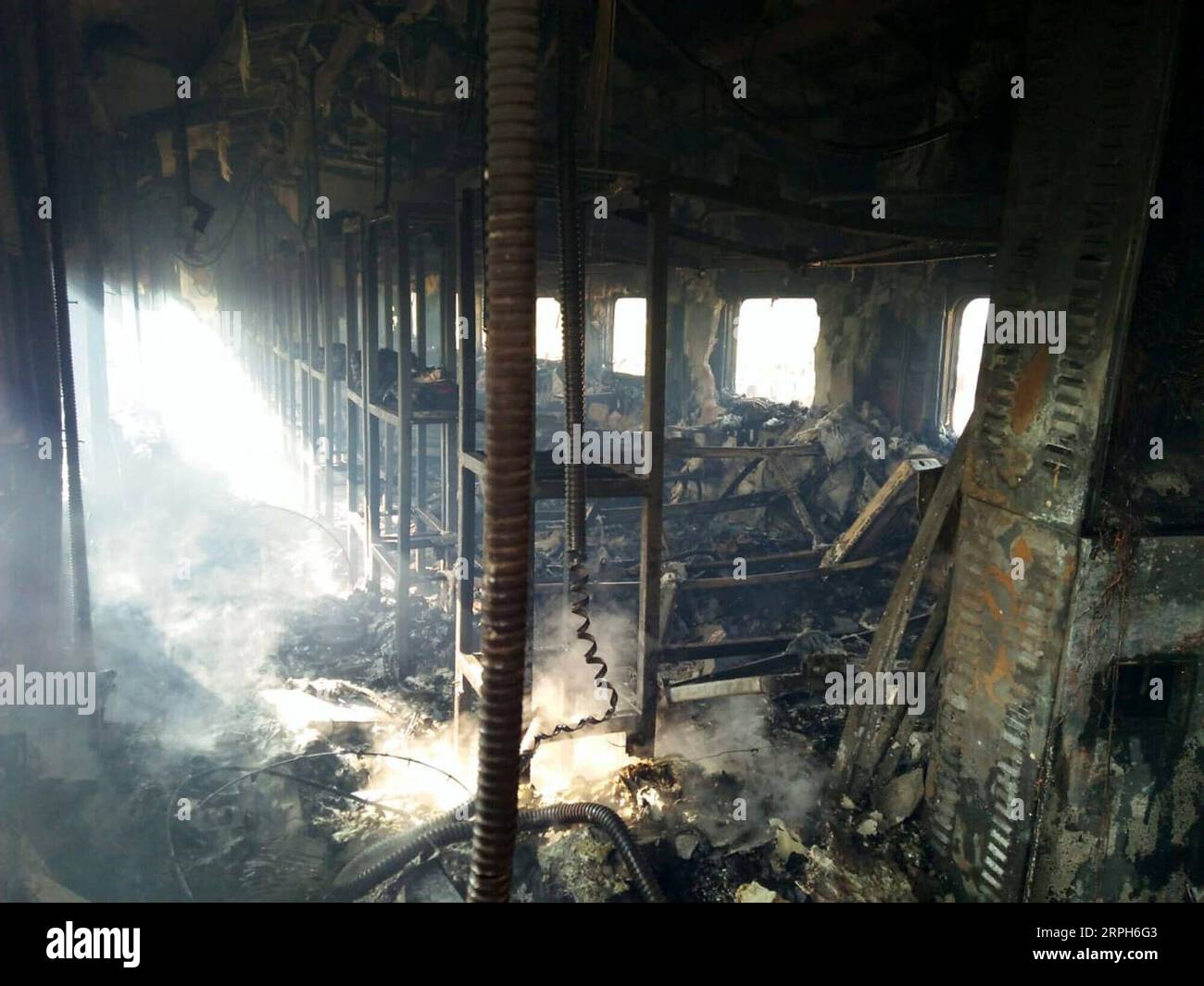 191031 -- RAHIM YAR KHAN, Oct. 31, 2019 -- Photo taken with mobile phone shows a burnt compartment of a passenger train in Rahim Yar Khan district of Pakistan s east Punjab province on Oct. 31, 2019. At least 65 people were killed and 14 others injured after a passenger train caught fire in Rahim Yar Khan district of Pakistan s east Punjab province on Thursday, a rescue official and local reports said. The death toll is feared to rise as rescue work continues to recover more bodies from the compartments gutted in the fire, Baqir Hussain, district emergency officer of state-owned Rescue 1122, t Stock Photo