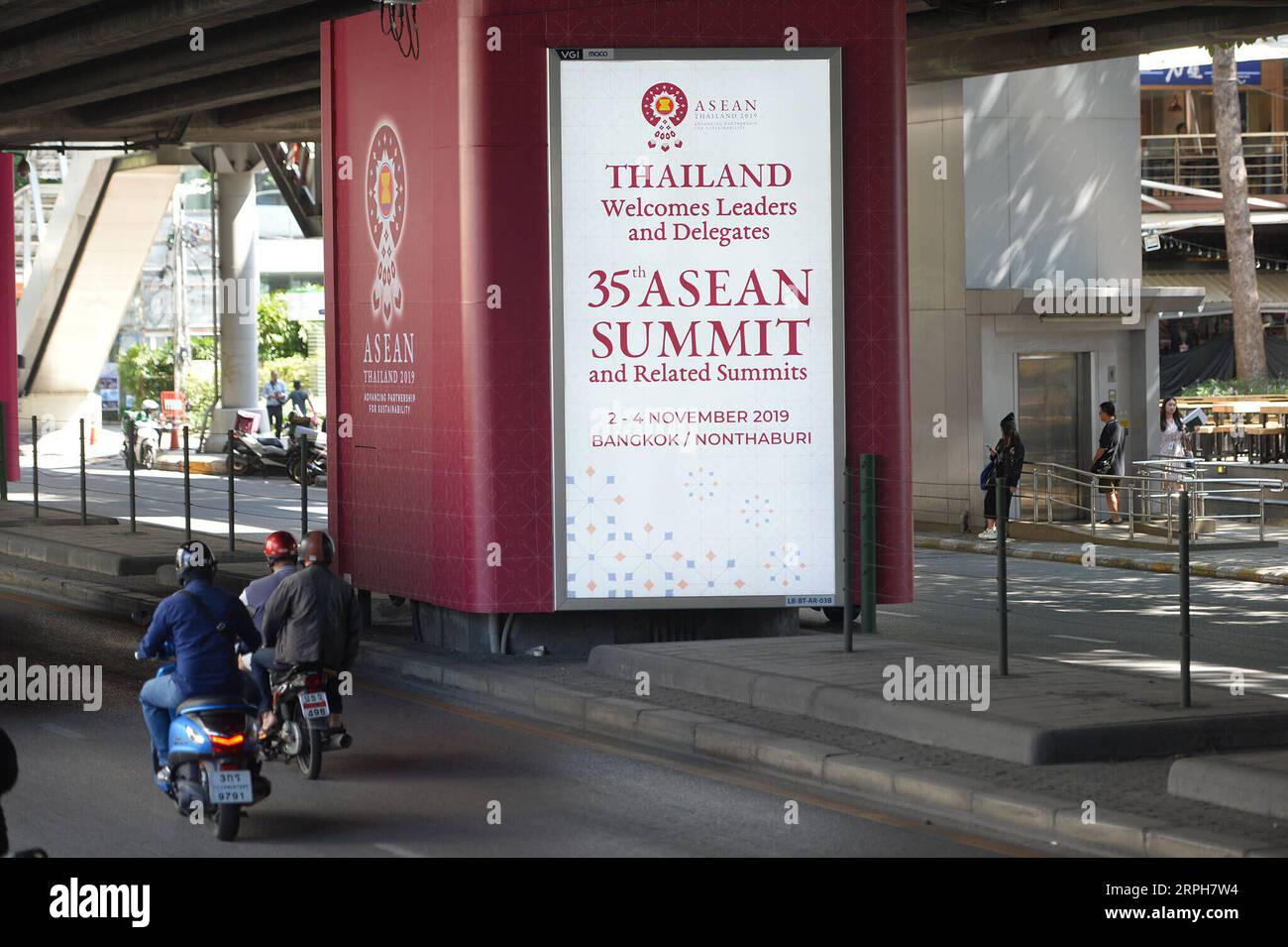 191101 -- BANGKOK, Nov. 1, 2019 -- People pass by a poster of the 35th ASEAN summit and related summits in Bangkok, Thailand, Oct. 30, 2019. The 35th ASEAN summit and related summits are scheduled for Nov. 2 to 4 in Bangkok. Rachen Sageamsak THAILAND-BANGKOK-ASEAN SUMMIT-PREPARATION LaxHeng PUBLICATIONxNOTxINxCHN Stock Photo
