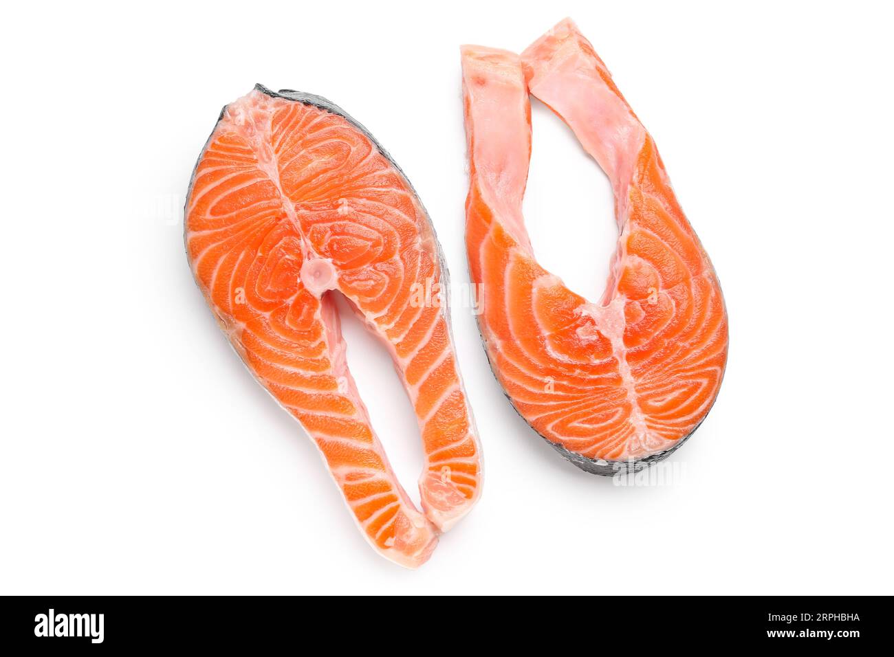 Raw salmon steaks on white background Stock Photo - Alamy