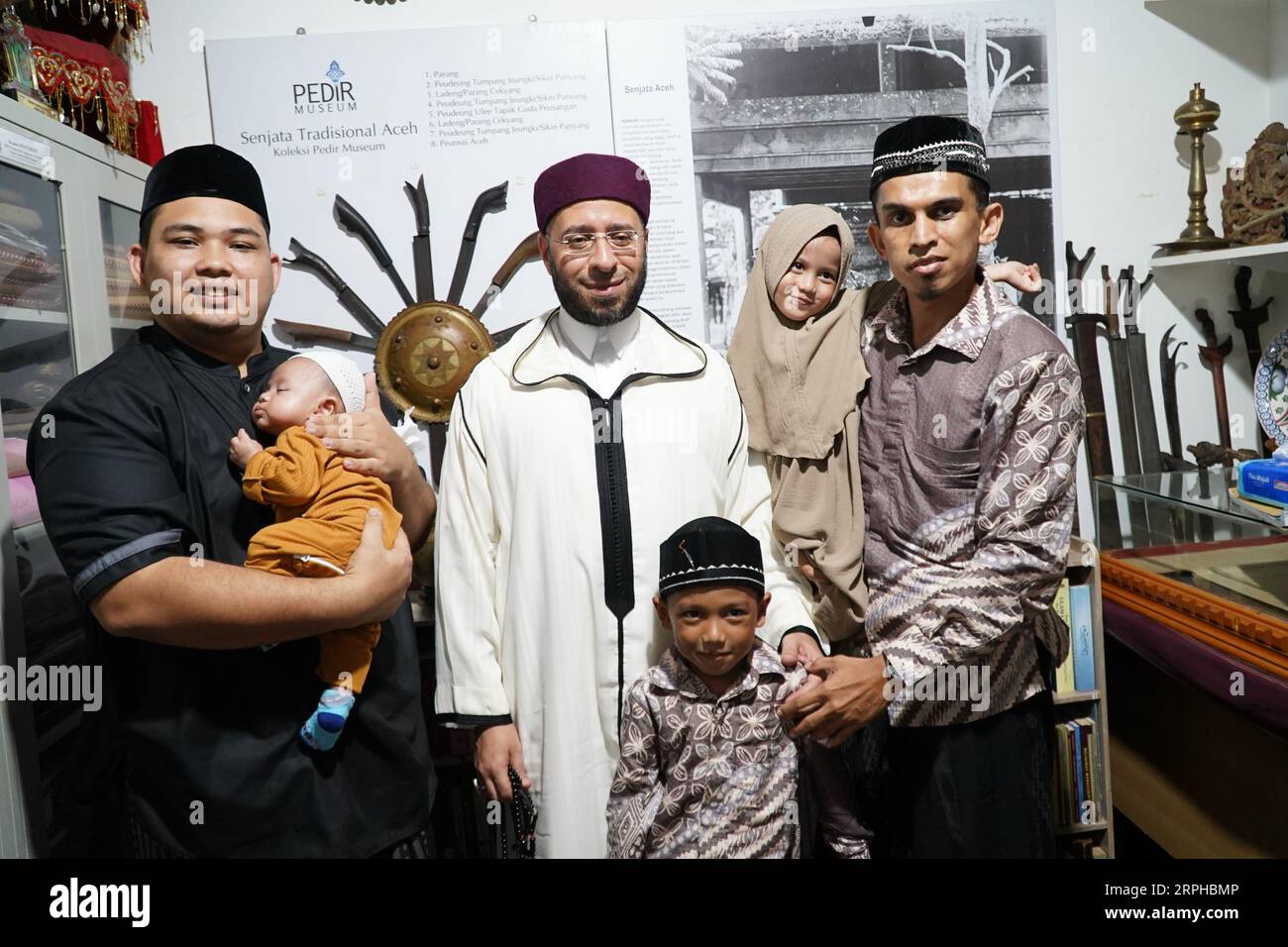 Sheikh Usama Elsayed Alazary with employees of the Pedir and Mapesa Museum Banda Aceh, Indonesia Stock Photo