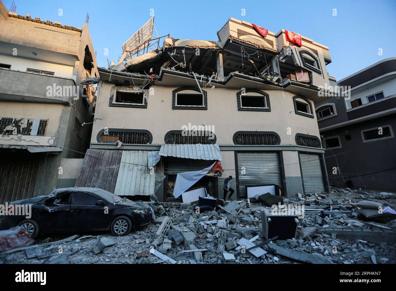 191112 -- GAZA, Nov. 12, 2019 Xinhua -- A Palestinian inspects the damaged house of Islamic Jihad leader Baha Abu al-Atta after an Israeli attack in Gaza City, Nov. 12, 2019. Baha Abu al-Atta, a senior militant and leader of al-Quds Brigades, the armed wing of the Palestinian Islamic Jihad in the Gaza Strip, and his wife were killed earlier Tuesday in an Israeli aerial attack on their house in eastern Gaza city. Photo by Mohammed Dahman/Xinhua MIDEAST-GAZA-ATTACK PUBLICATIONxNOTxINxCHN Stock Photo