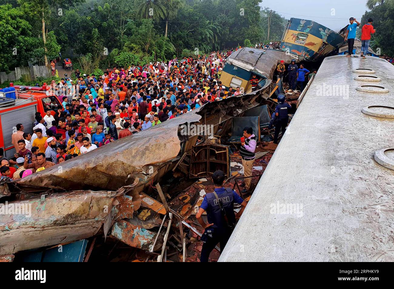 191112 -- DHAKA, Nov. 12, 2019 Xinhua -- People gather at the accident site in Bangladesh s Brahmanbaria district, Nov. 12, 2019. Authorities said negligence caused a head-on collision between two trains that killed 16 people early Tuesday in Bangladesh. The deadly accident snapped Bangladeshi capital Dhaka s rail links with southeastern seaport city Chattogram and northeastern Sylhet town. The trains, packed with people many of whom were sleeping, collided while crossing Mondobagh station in Brahmanbaria district, 109 km northeast of capital Dhaka. Str/Xinhua SPOT NEWSBANGLADESH-BRAHMANBARIA- Stock Photo