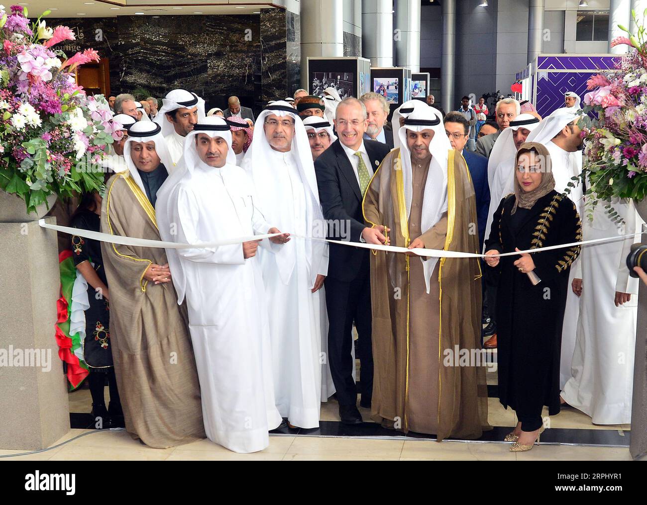 191120 -- HAWALLI GOVERNORATE, Nov. 20, 2019 Xinhua -- Mohammad Al-Jabri 2nd R, Front, Kuwaiti Minister of Information and Minister of State for Youth Affairs, cuts the ribbon during the opening ceremony of the 44th Kuwait International Book Fair in Hawalli Governorate, Kuwait, on Nov. 20, 2019. The 44th Kuwait International Book Fair kicked off on Wednesday at the Kuwait International Fairground. Three Chinese publishing houses participated in the book fair. Photo by Asad/Xinhua KUWAIT-HAWALLI GOVERNORATE-INTERNATIONAL BOOK FAIR PUBLICATIONxNOTxINxCHN Stock Photo
