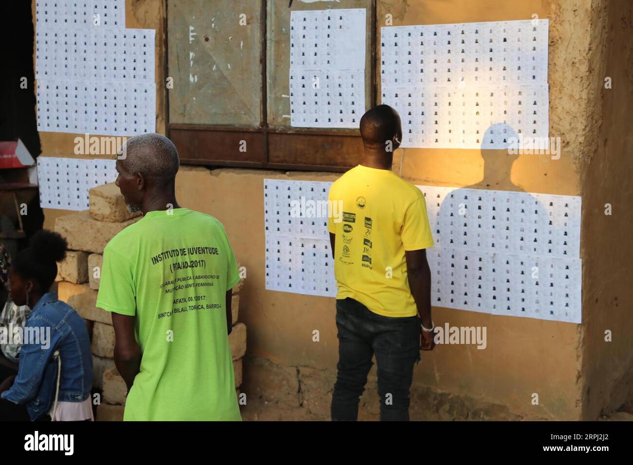 191124 -- BISSAU, Nov. 24, 2019 -- A voter looks for his name at a polling station in Bissau, capital of Guinea-Bissau, on Nov. 24, 2019. Guinea-Bissau s presidential election kicked off Sunday with 12 candidates competing to become the west African country s president for the next five years.  GUINEA-BISSAU-BISSAU-PRESIDENTIAL ELECTION XingxJianqiao PUBLICATIONxNOTxINxCHN Stock Photo