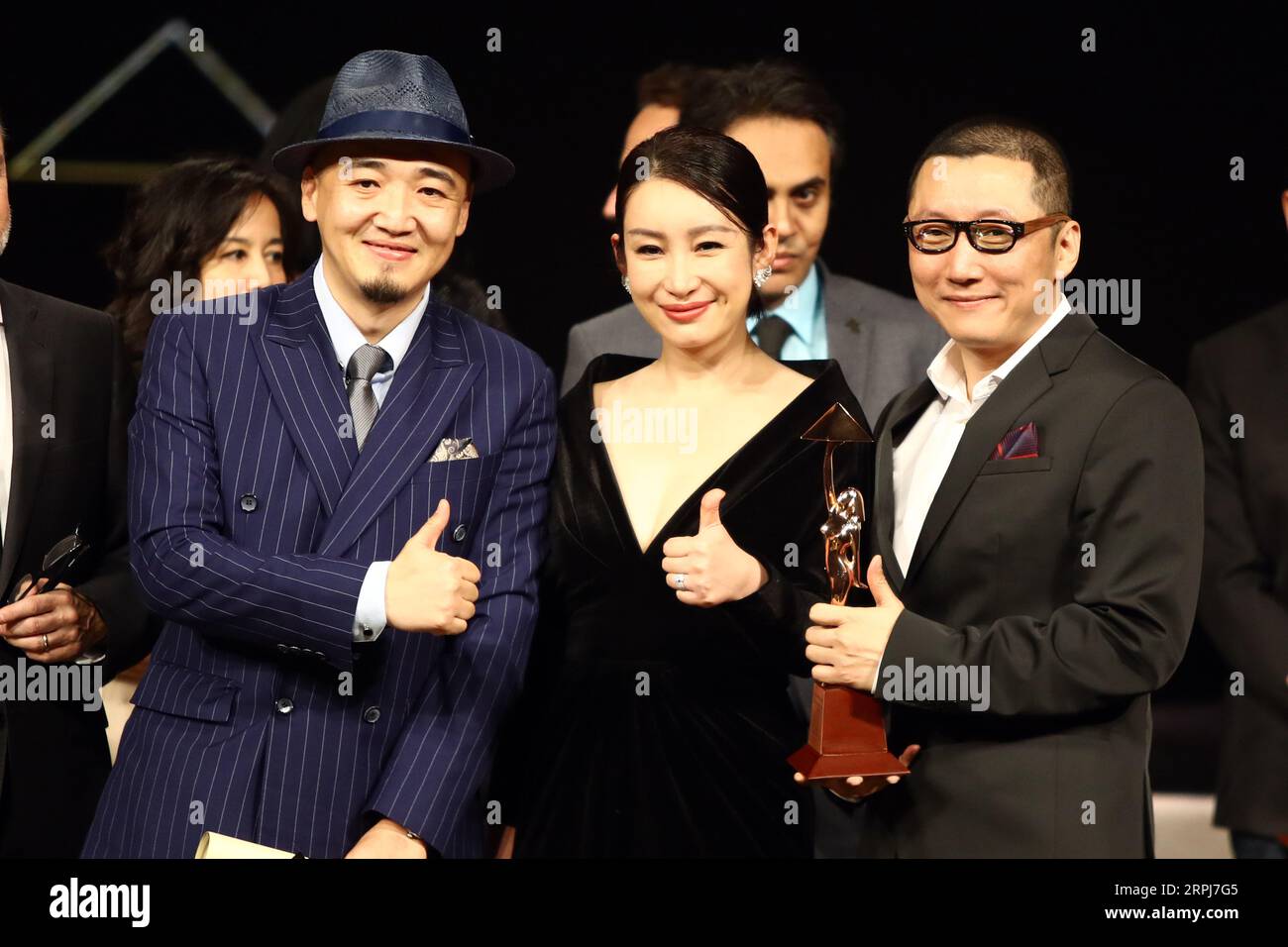 191129 -- CAIRO, Nov. 29, 2019 -- Director Zhang Chong L and Zhang Bo R of Chinese movie The Fourth Wall and Chinese actress Qin Hailu, who is a member of the international jury, pose for a photo during the awarding ceremony of Cairo International Film Festival in Cairo, Egypt, on Nov. 29, 2019. The 41st edition of Egypt s Cairo International Film Festival CIFF concluded Friday night at Cairo Opera House with China s movie The Fourth Wall winning an award at the official film section competition. Ahmed Gomaa EGYPT-CAIRO-INT L FILM FESTIVAL-AWARDING CEREMONY AixHamaidegema PUBLICATIONxNOTxINxCH Stock Photo
