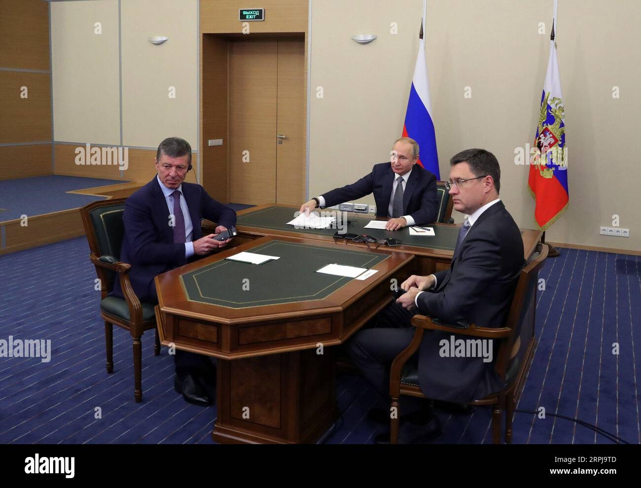 191202 -- MOSCOW, Dec. 2, 2019 Xinhua -- Russian President Vladimir Putin C, Russian Energy Minister Alexander Novak R and Deputy Prime Minister Dmitry Kozak watch the launching ceremony of the China-Russia east-route natural gas pipeline via teleconference in Sochi, Russia, Dec. 2, 2019. Chinese President Xi Jinping had a video call with his Russian counterpart Vladimir Putin Monday afternoon, as the two heads of state jointly witnessed the launching ceremony of the China-Russia east-route natural gas pipeline. Sputnik/Handout via Xinhua RUSSIA-CHINA-PUTIN-NATURAL GAS PIPELINE-LAUNCH PUBLICAT Stock Photo