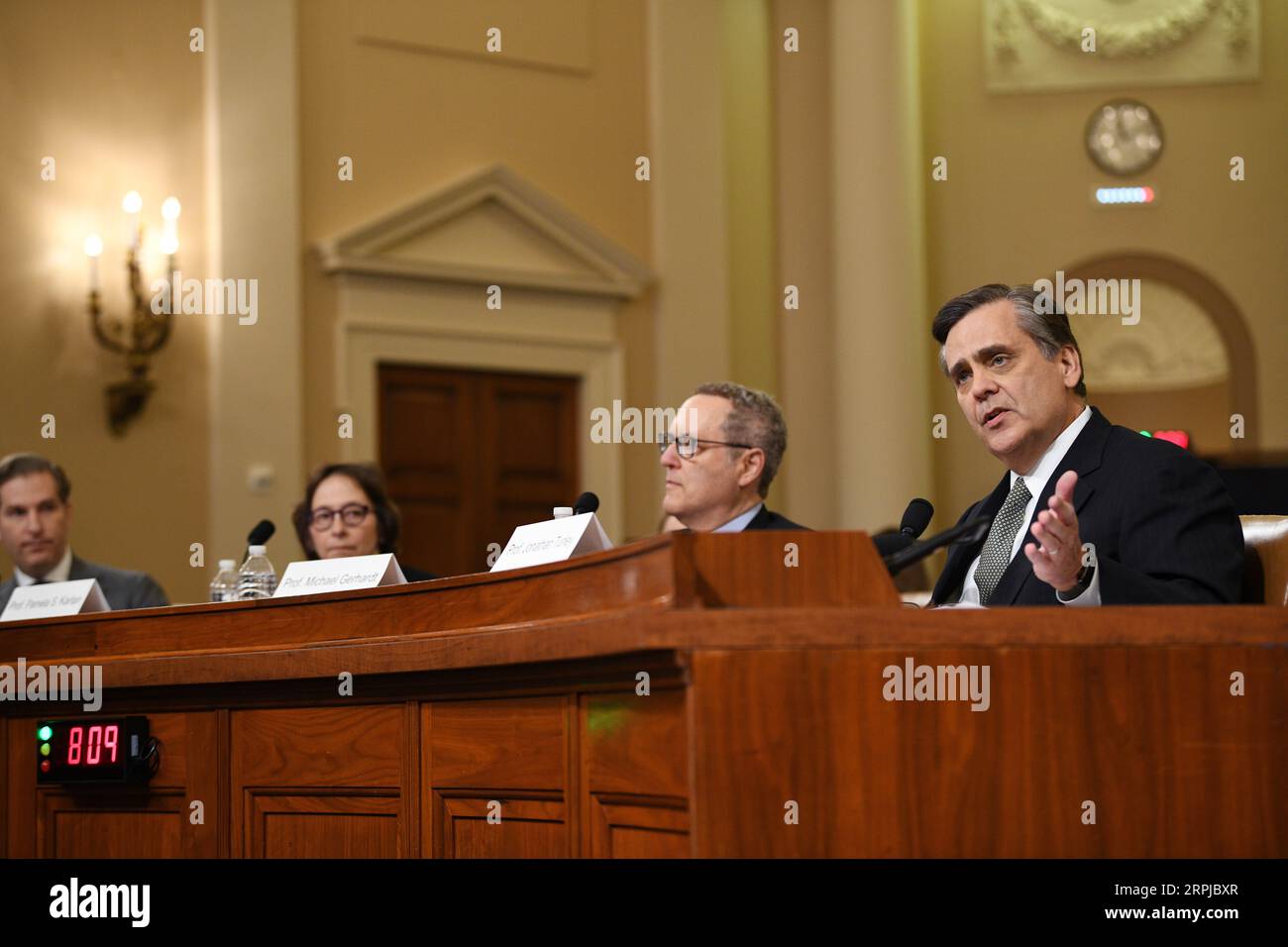 191204 -- WASHINGTON, Dec. 4, 2019 -- Jonathan Turley 1st R, professor of public interest law at the George Washington University Law School, testifies before the U.S. House Judiciary Committee on Capitol Hill in Washington D.C., the United States, on Dec. 4, 2019. The Democrat-led House Judiciary Committee took over a months-long impeachment proceeding into U.S. President Donald Trump by holding its first hearing on Wednesday.  U.S.-WASHINGTON D.C.-HOUSE-JUDICIARY COMMITTEE-HEARING-IMPEACHMENT INQUIRY-TRUMP LiuxJie PUBLICATIONxNOTxINxCHN Stock Photo